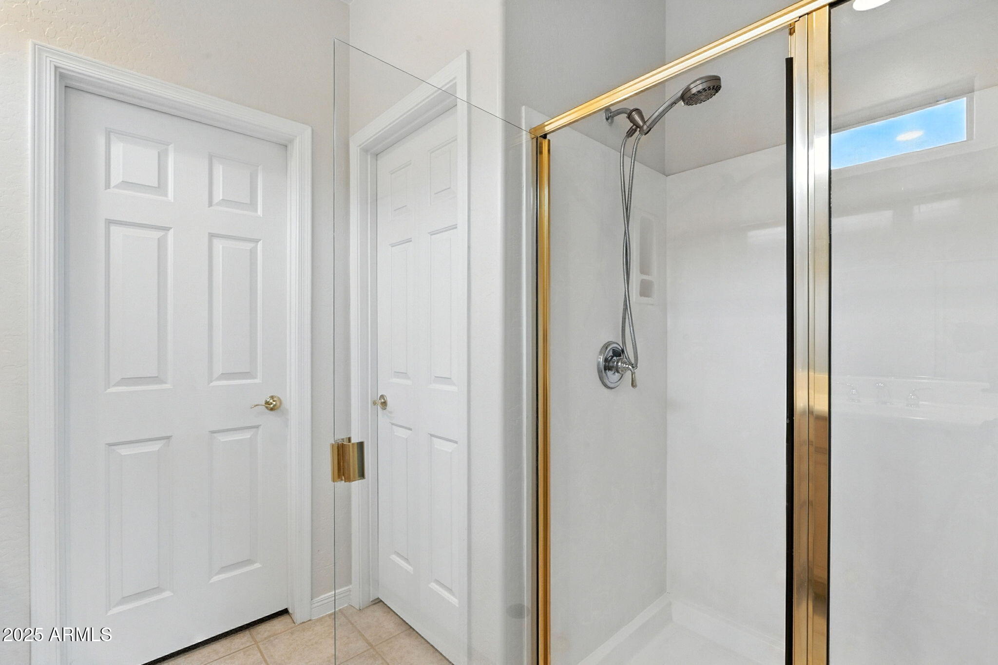 16420 North Thompson Peak Parkway, Unit 2031 Scottsdale, AZ 85260 - Photo 26 of 30 a bathroom with a glass shower door