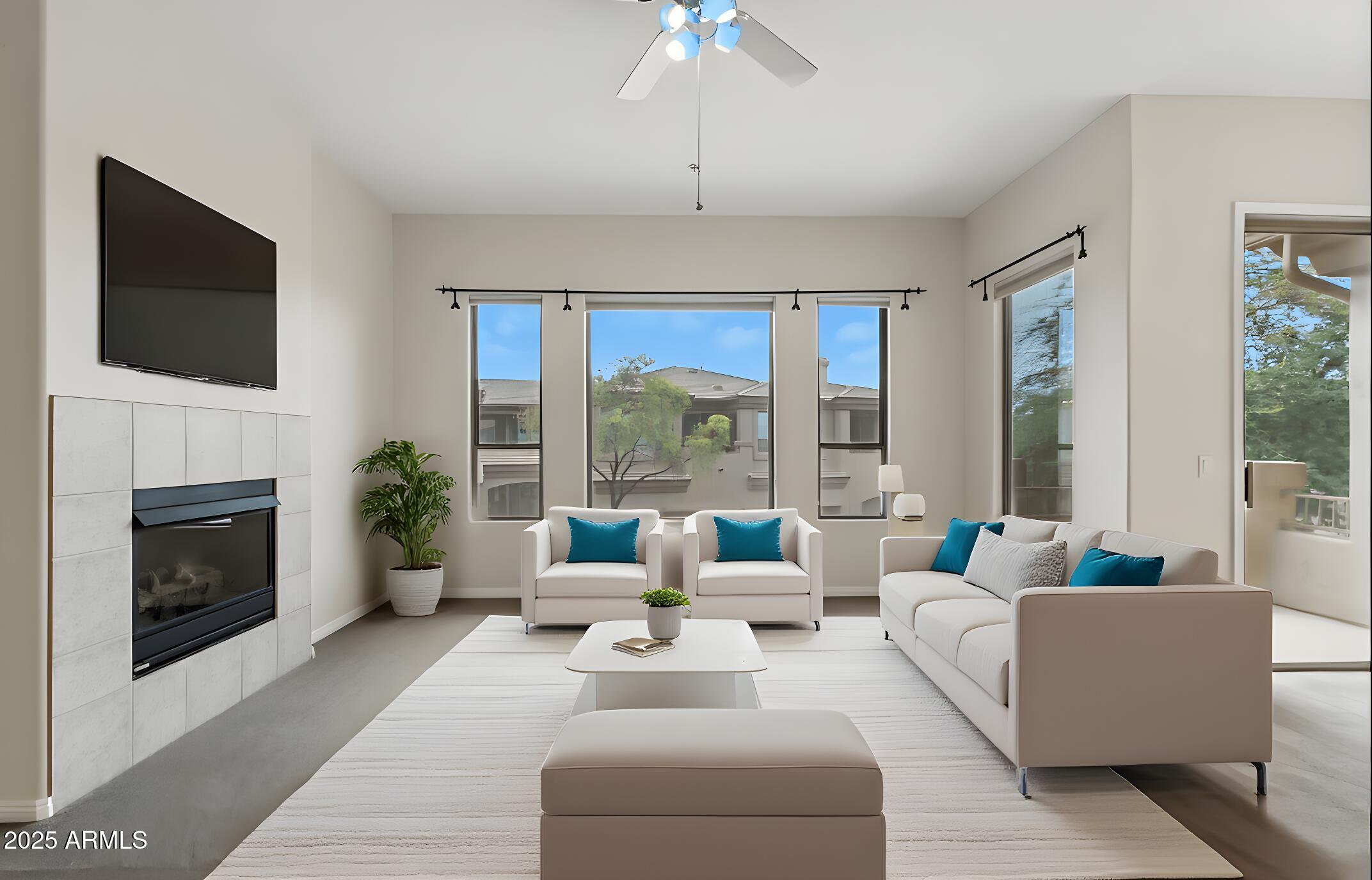 16420 North Thompson Peak Parkway, Unit 2031 Scottsdale, AZ 85260 - Photo 5 of 30 a living room with furniture fireplace and large windows