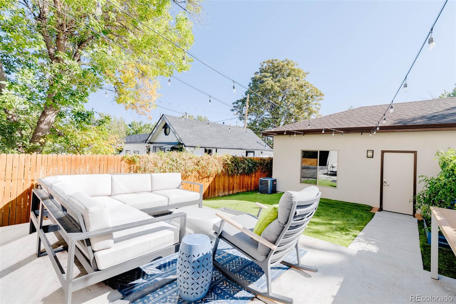 3738 Raleigh Street Denver, CO 80212 - Photo 18 of 34 a balcony with furniture and a garden