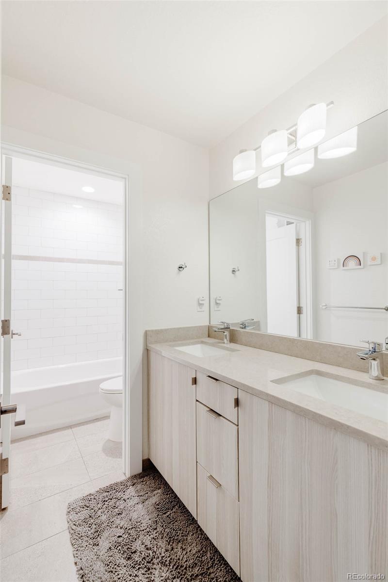 3738 Raleigh Street Denver, CO 80212 - Photo 25 of 34 a bathroom with a sink and a mirror