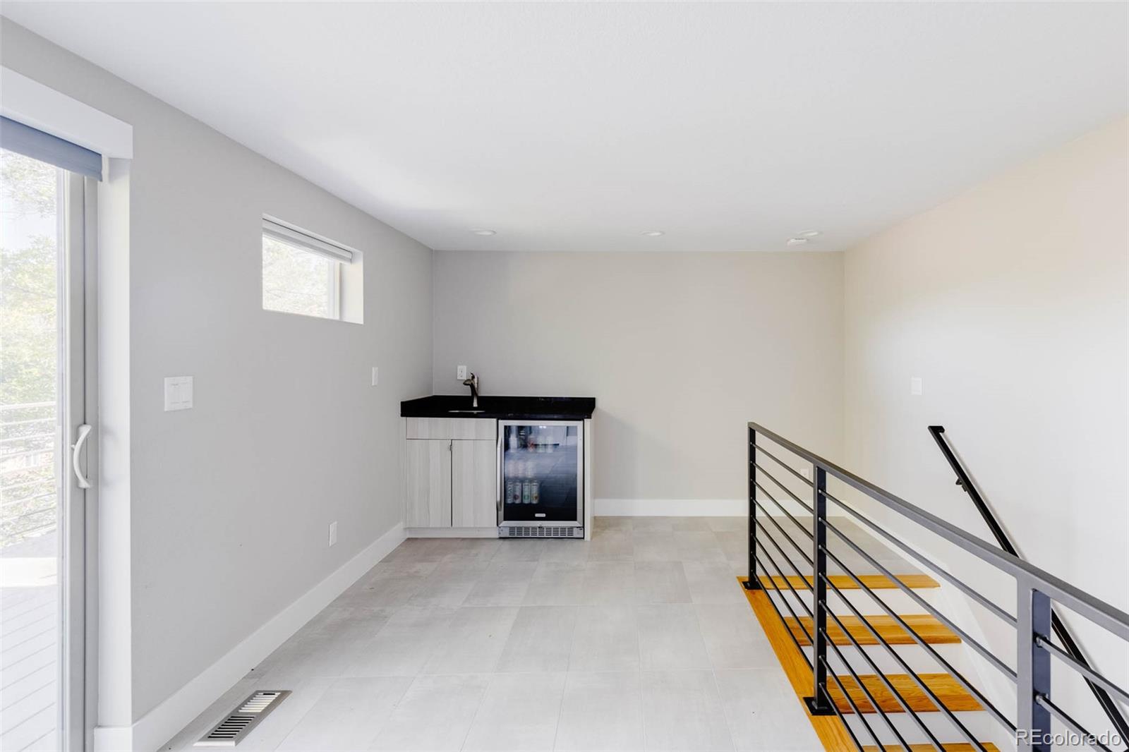 3738 Raleigh Street Denver, CO 80212 - Photo 27 of 34 a view of an empty room and kitchen