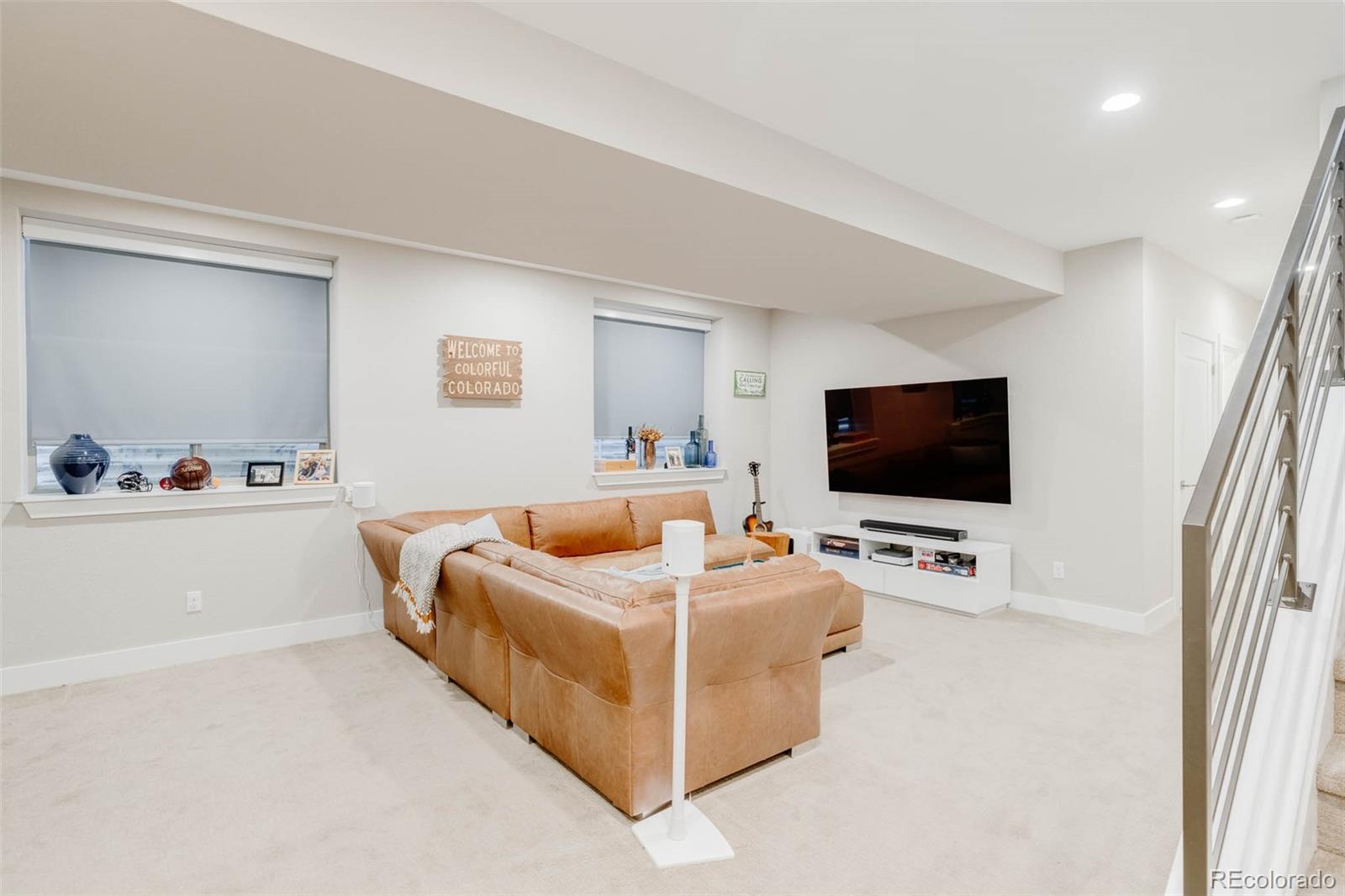3738 Raleigh Street Denver, CO 80212 - Photo 31 of 34 a living room with furniture and a flat screen tv