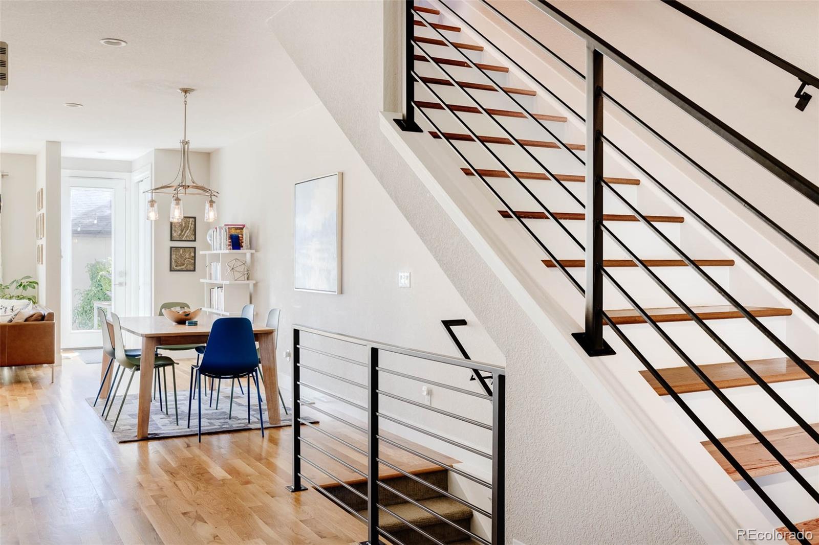 3738 Raleigh Street Denver, CO 80212 - Photo 7 of 34 a living room with furniture and wooden floor