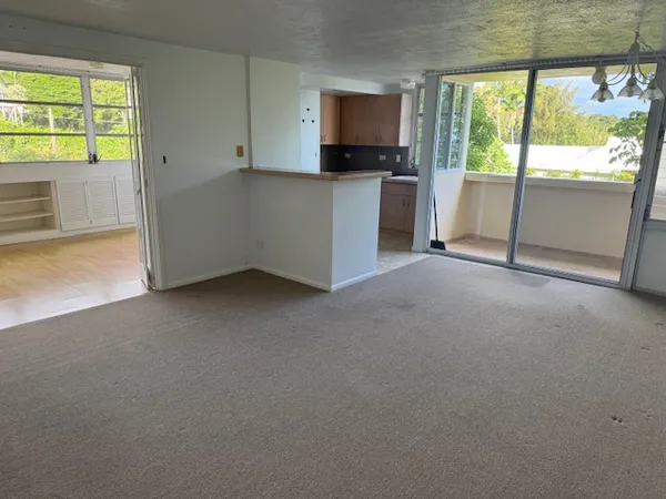 a view of an empty room with a window