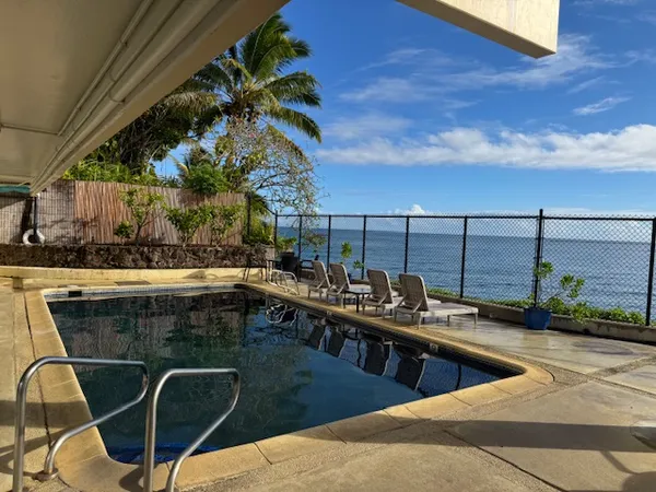 a view of a swimming pool with a chair