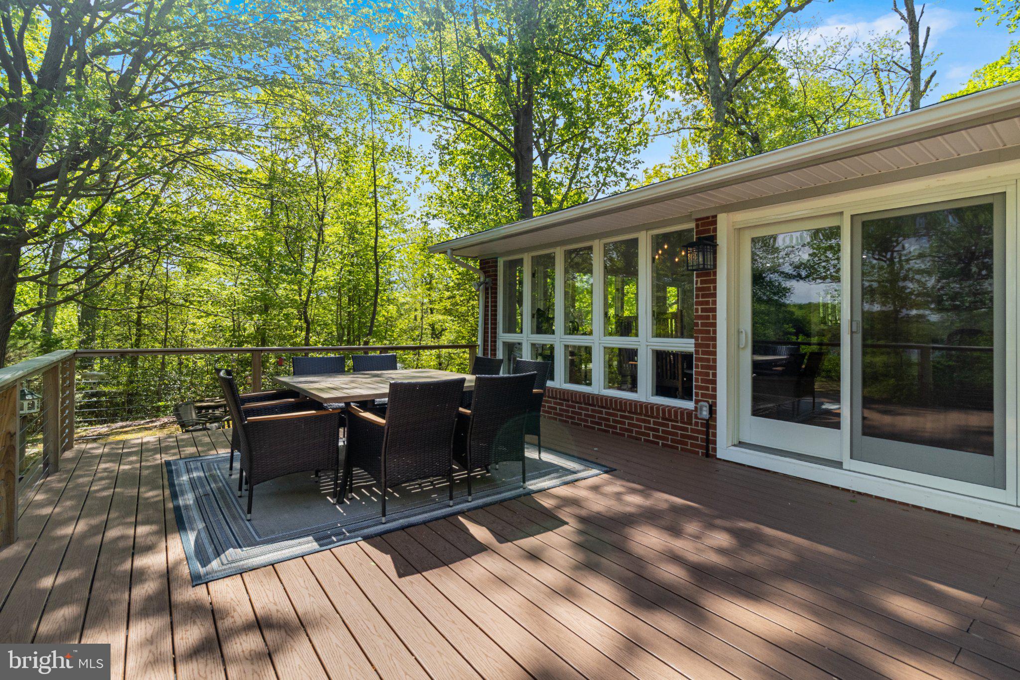 43671 Sunny Ridge Lane Hollywood, MD 20636 - Photo 11 of 45 Serene deck nestled in lush greenery.