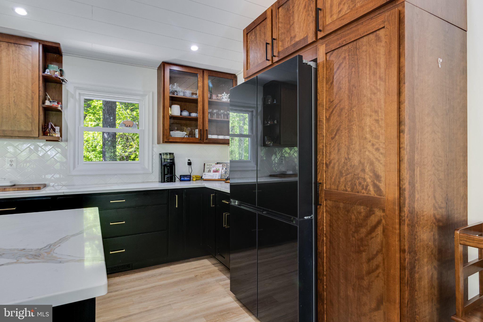 43671 Sunny Ridge Lane Hollywood, MD 20636 - Photo 17 of 45 Modern kitchen with rich wood accents.