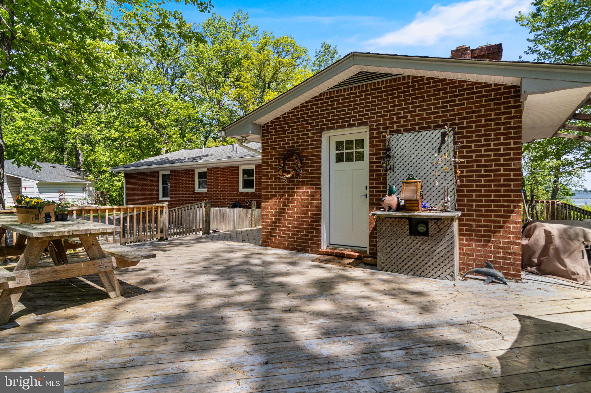 43671 Sunny Ridge Lane Hollywood, MD 20636 - Photo 7 of 45 Charming deck amidst lush greenery.
