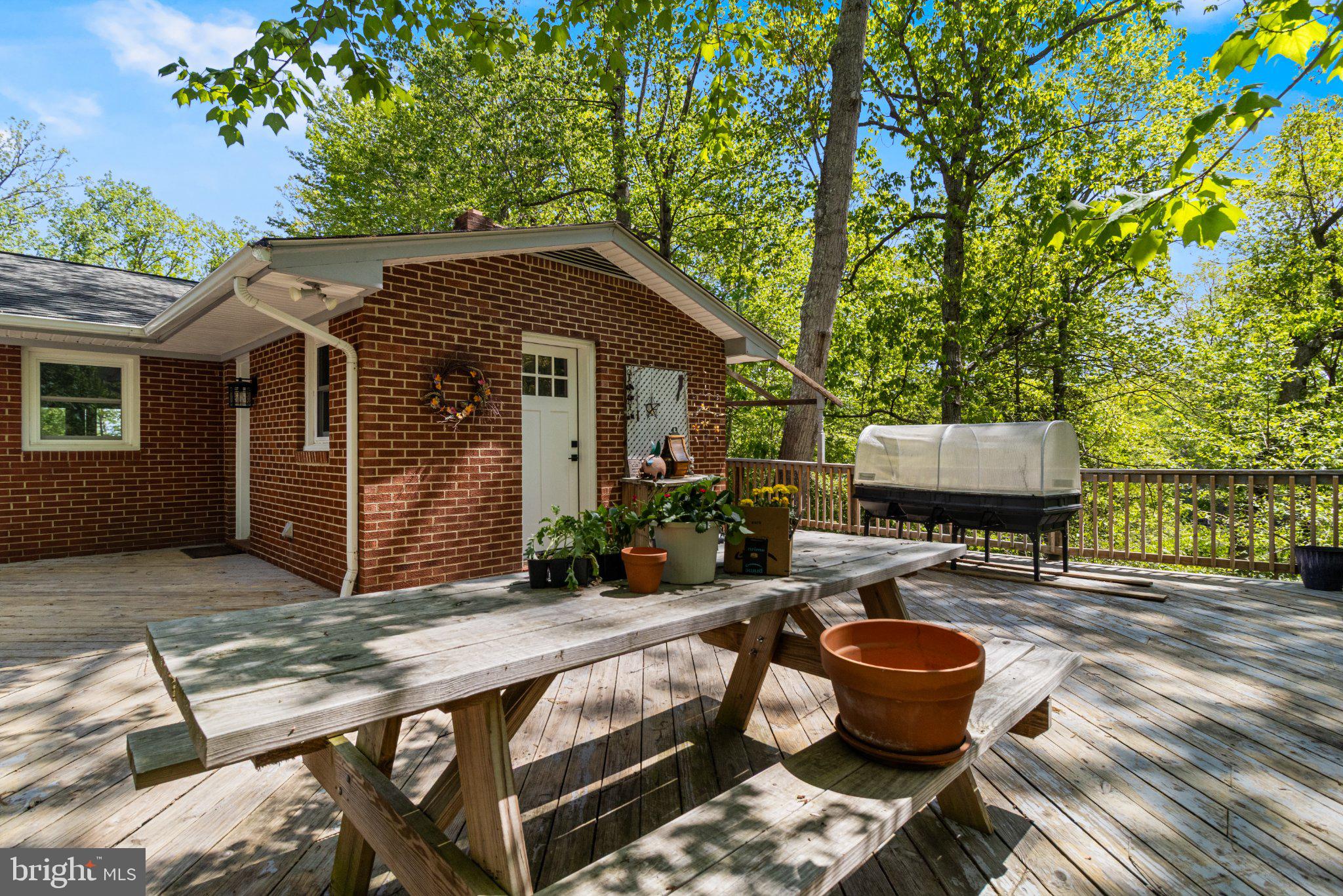 43671 Sunny Ridge Lane Hollywood, MD 20636 - Photo 8 of 45 Charming deck amidst lush greenery.