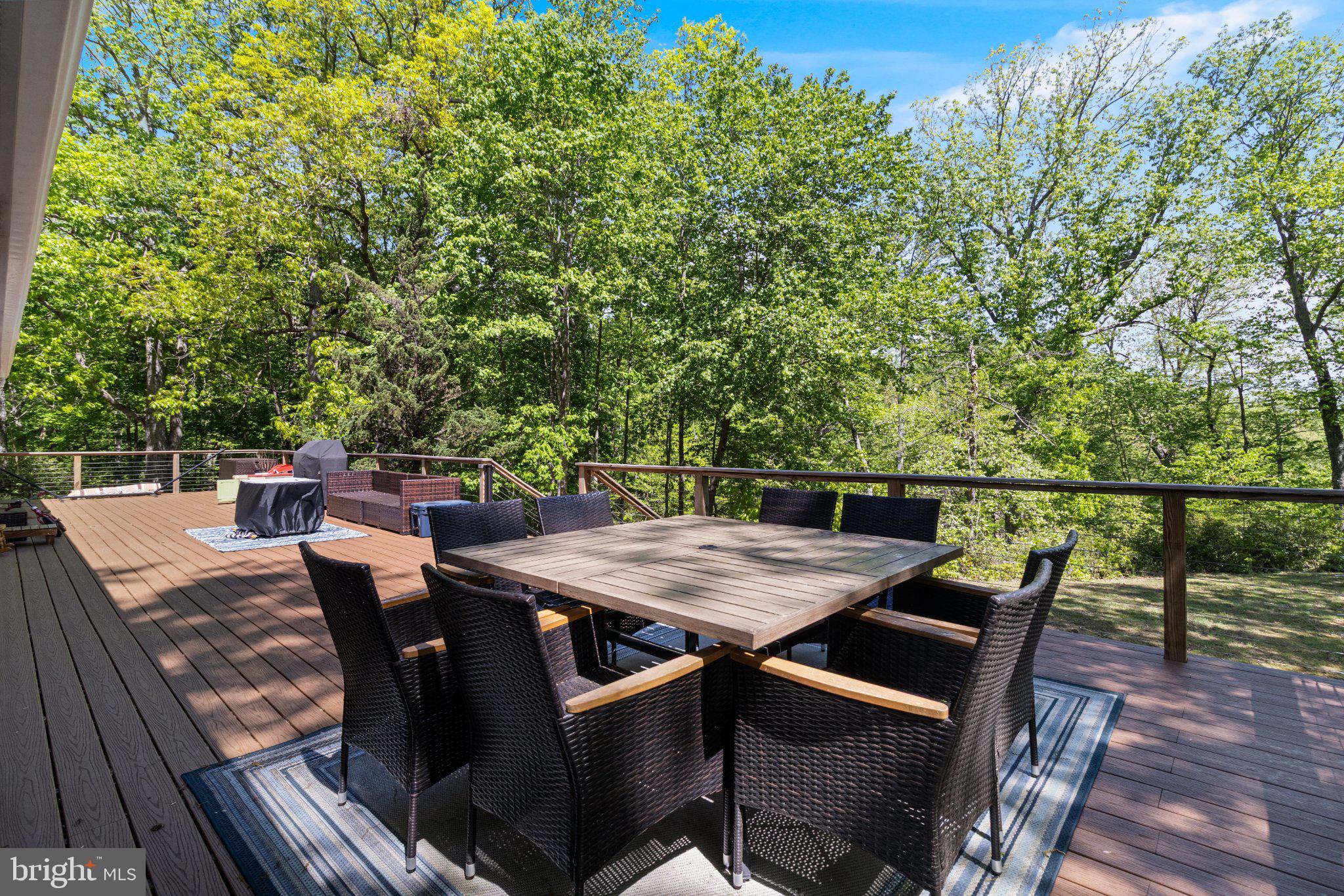 43671 Sunny Ridge Lane Hollywood, MD 20636 - Photo 9 of 45 Serene deck surrounded by lush greenery.