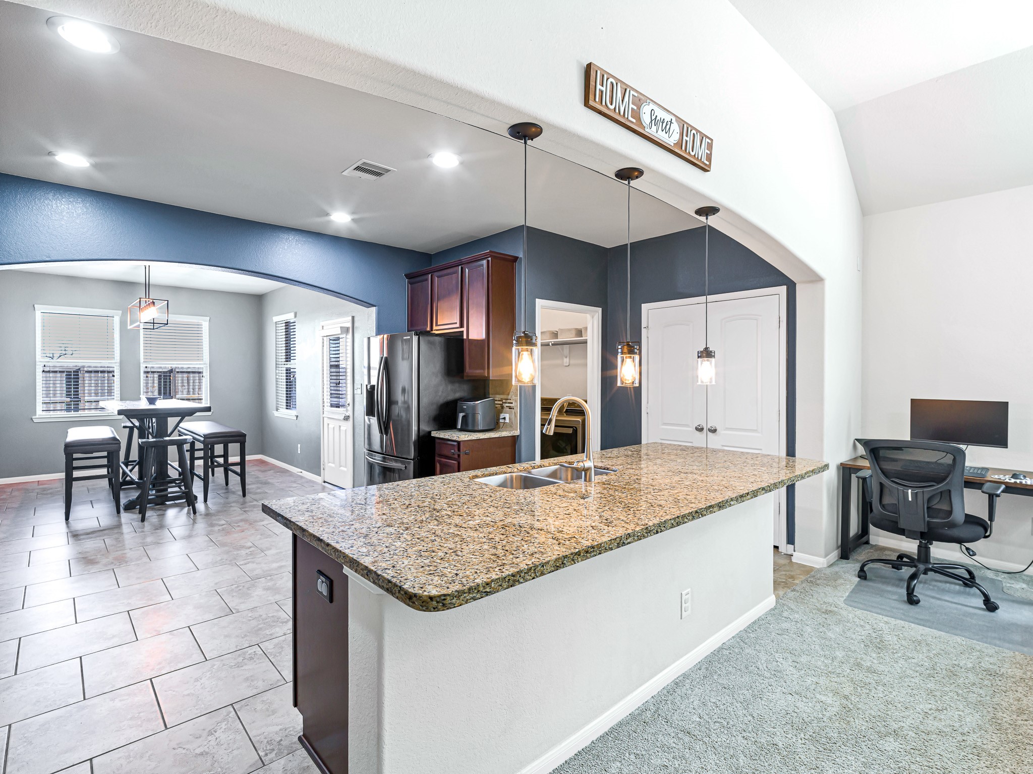 5622 Maxon Court Rosenberg, TX 77471 - Photo 11 of 23 Seamless transition to the large, bright, beautiful breakfast room! This functional layout also features a double door pantry and a dedicated utility room...with window for plenty of natural light!