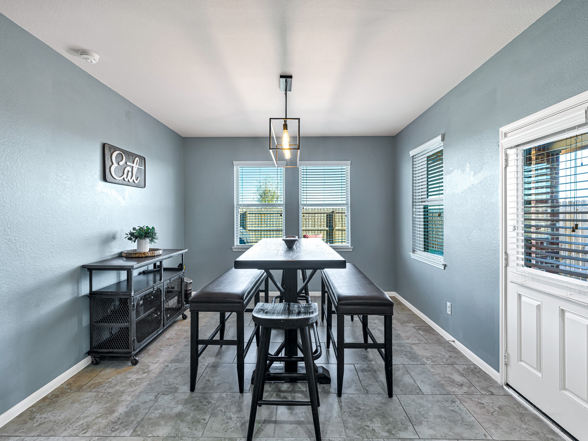 5622 Maxon Court Rosenberg, TX 77471 - Photo 12 of 23 This oversized breakfast room is full of windows, bright light and a great view of the backyard! The door leads to the back covered back porch offering easy access to the kitchen and outdoors!