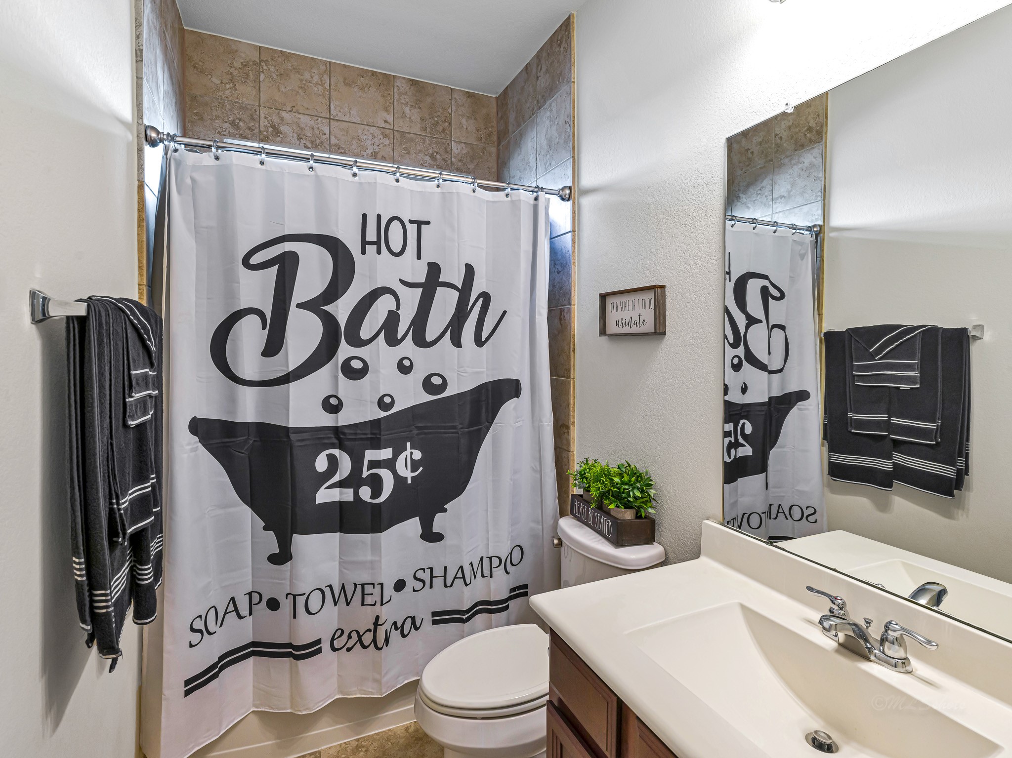 5622 Maxon Court Rosenberg, TX 77471 - Photo 18 of 23 The second bathroom is convenient to both secondary bedrooms, featuring a large vanity and a tiled tub / shower combination, offering quality and convenience for residents and guests alike!