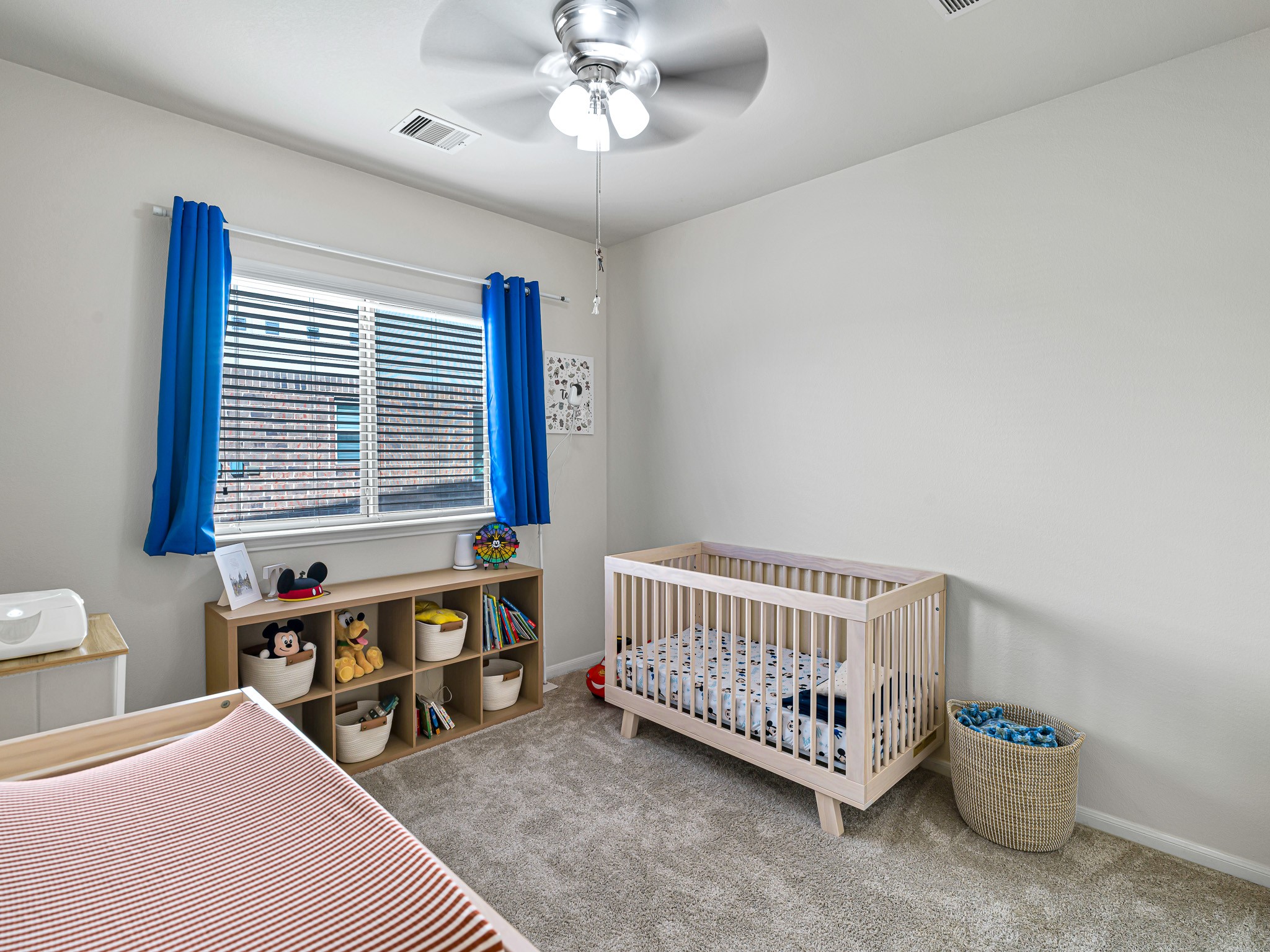 5622 Maxon Court Rosenberg, TX 77471 - Photo 19 of 23 Each secondary bedroom is designed with comfort in mind, offering high ceilings, ceiling fans, plush carpeting and large windows that fill the space with natural light.