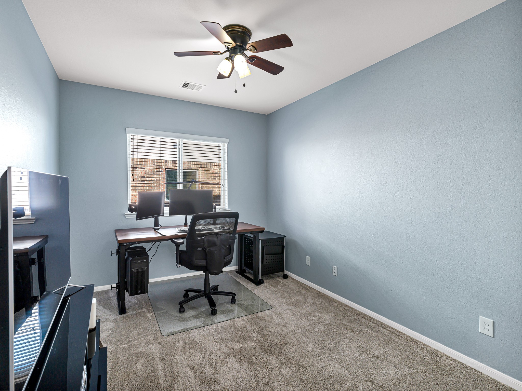 5622 Maxon Court Rosenberg, TX 77471 - Photo 7 of 23 Tucked away behind french doors, this bright flex space offers the perfect home office while staying connected to the heart of the home. With its own closet, this room offers endless possibilities-it could easily serve as a media room for entertaining or even a functional 4th bedroom! Imagine the possibilities!