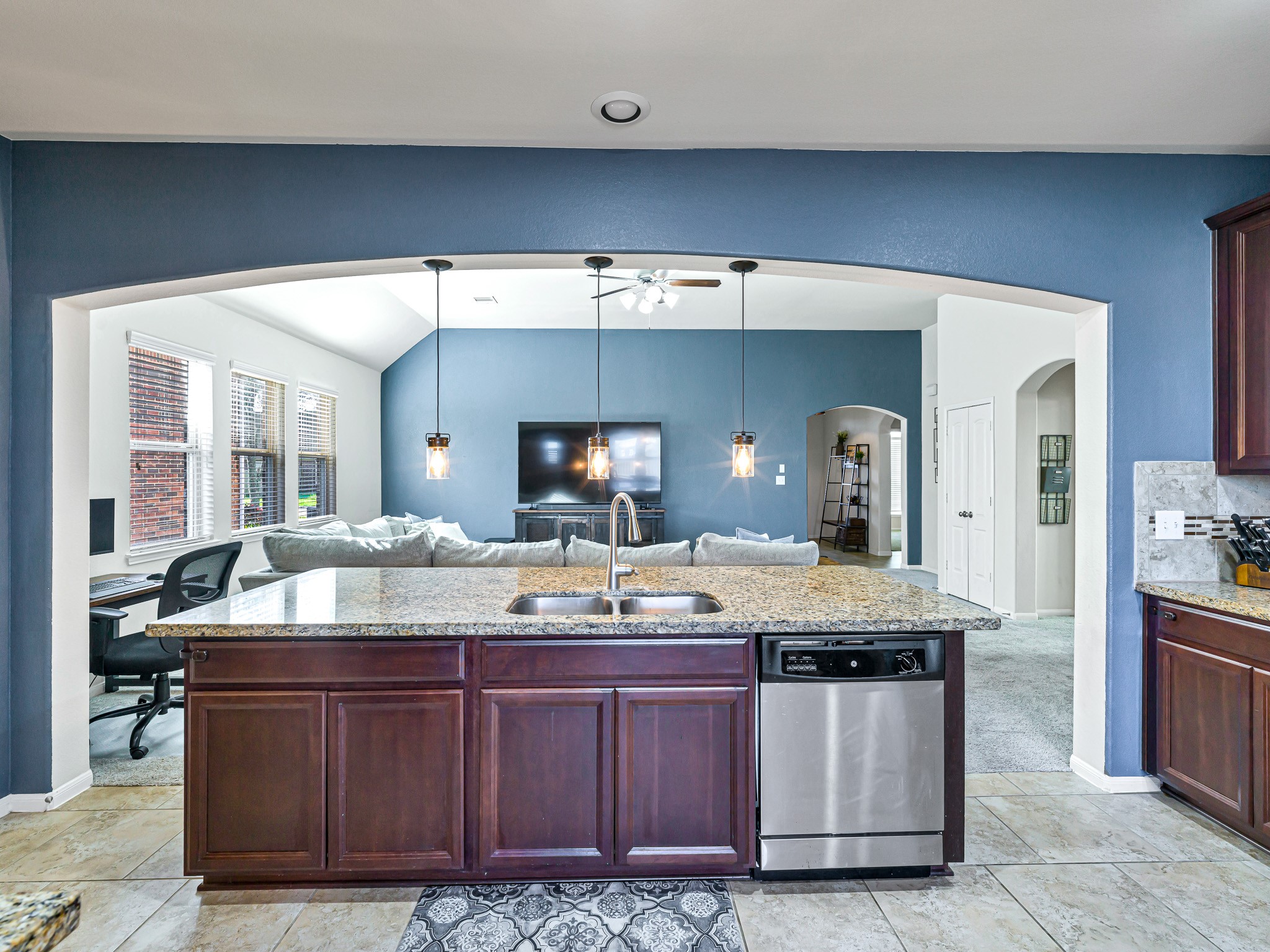 5622 Maxon Court Rosenberg, TX 77471 - Photo 10 of 23 Enjoy an open-concept layout that keeps you connected, with a sprawling breakfast bar and ample cabinet storage designed for both daily life and entertaining!