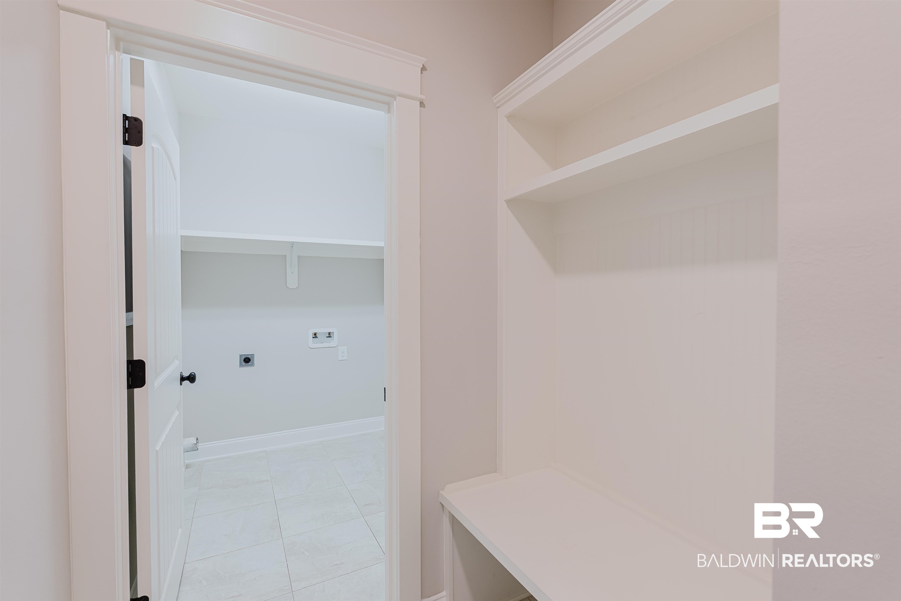 237 Hawthorne Circle Fairhope, AL 36532 - Photo 10 of 14 Mudroom with light tile patterned flooring and baseboards