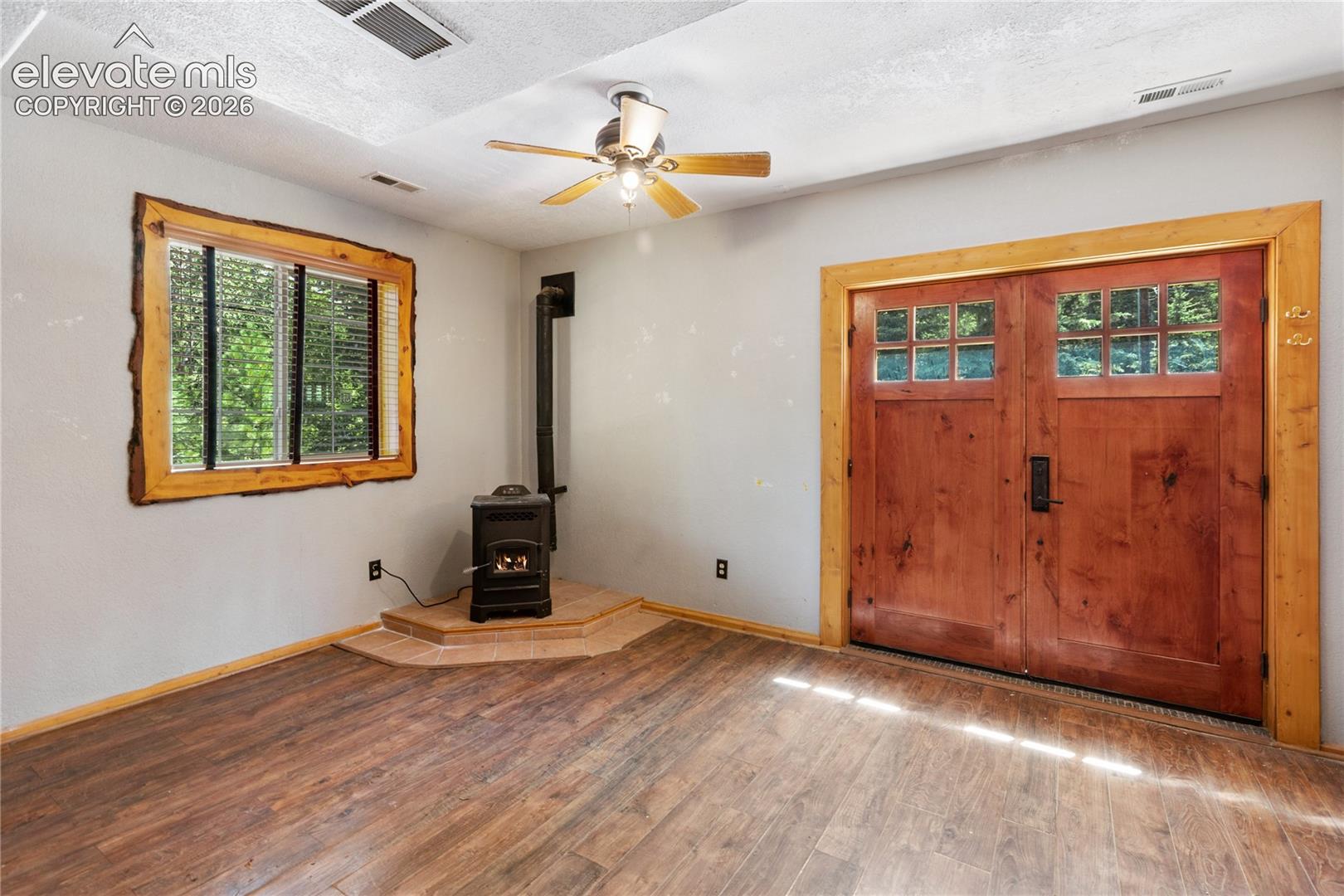 734 Kutsu Ridge Road Florissant, CO 80816 - Photo 24 of 41 2nd living room on lower level. Pellet stove for additional heat.