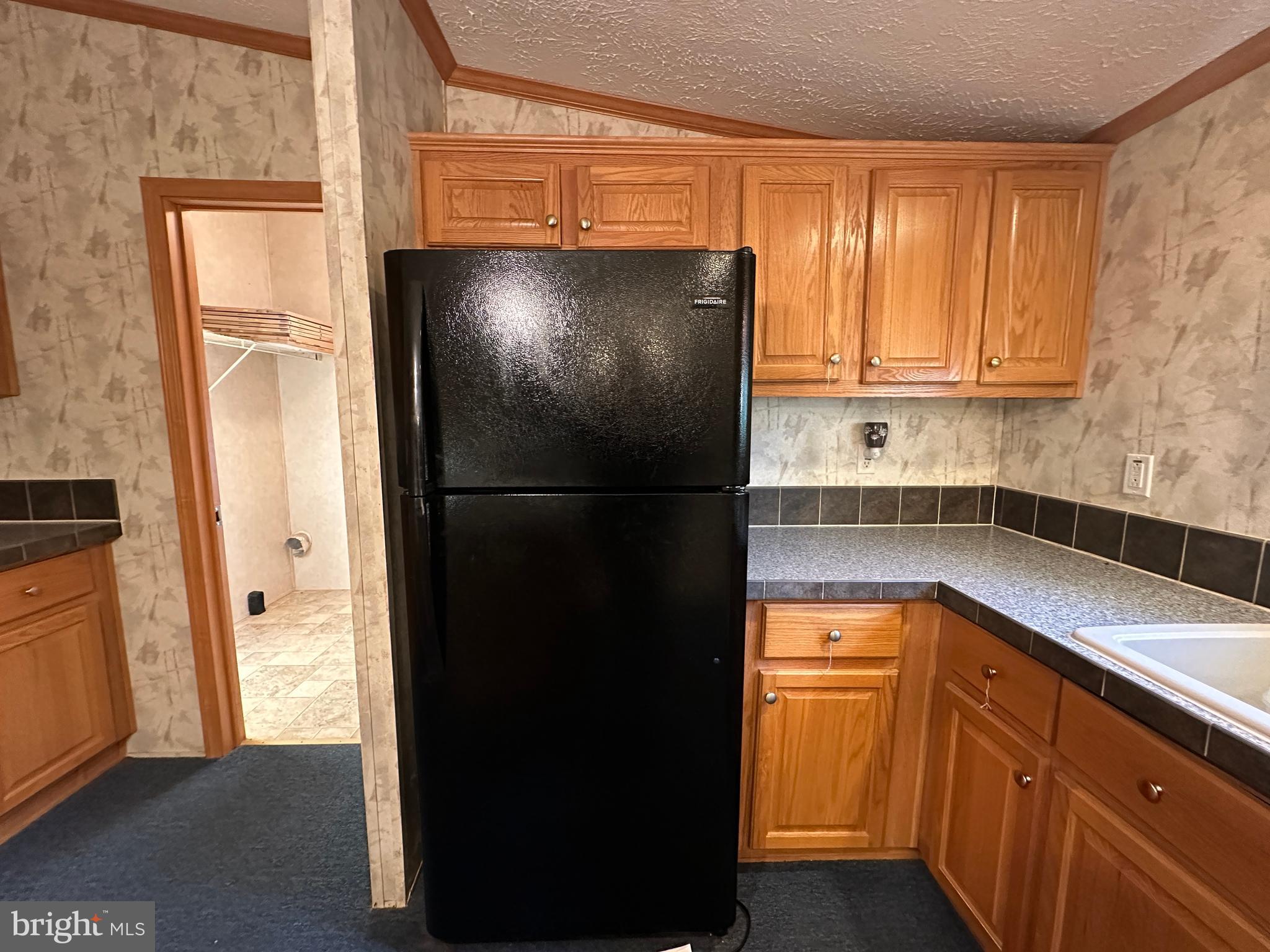 4391 Cito Road McConnellsburg, PA 17233 - Photo 37 of 67 a kitchen with a refrigerator and a sink