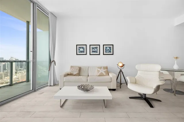 a living room with furniture a rug and a toilet