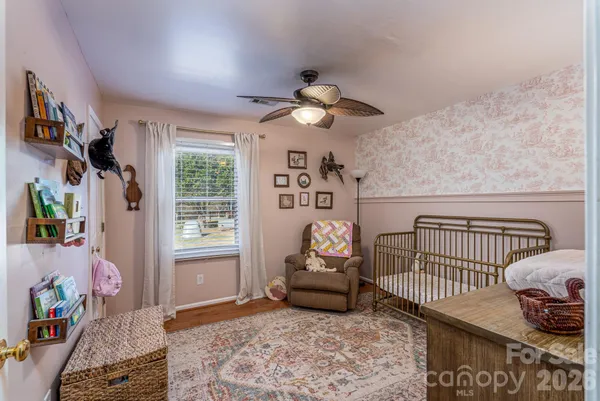 a bedroom with furniture and a window