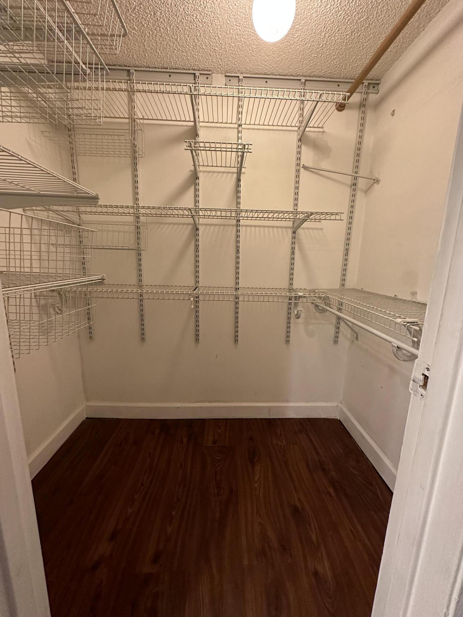 9370 Southwest 8th Street, Unit 419 Boca Raton, FL 33428 - Photo 15 of 18 a view of a room with wooden floor