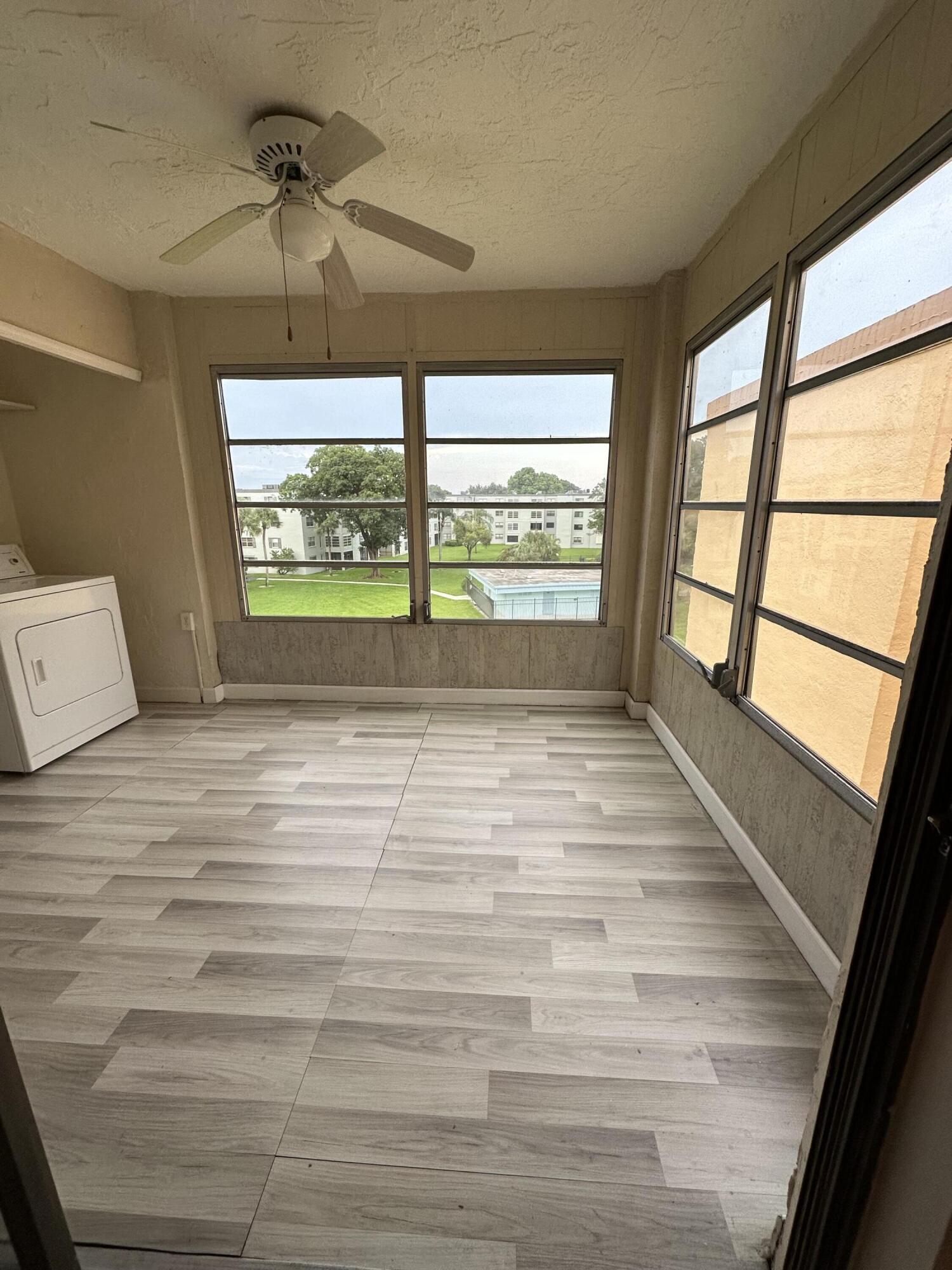 9370 Southwest 8th Street, Unit 419 Boca Raton, FL 33428 - Photo 10 of 18 a view of room window and wooden floor