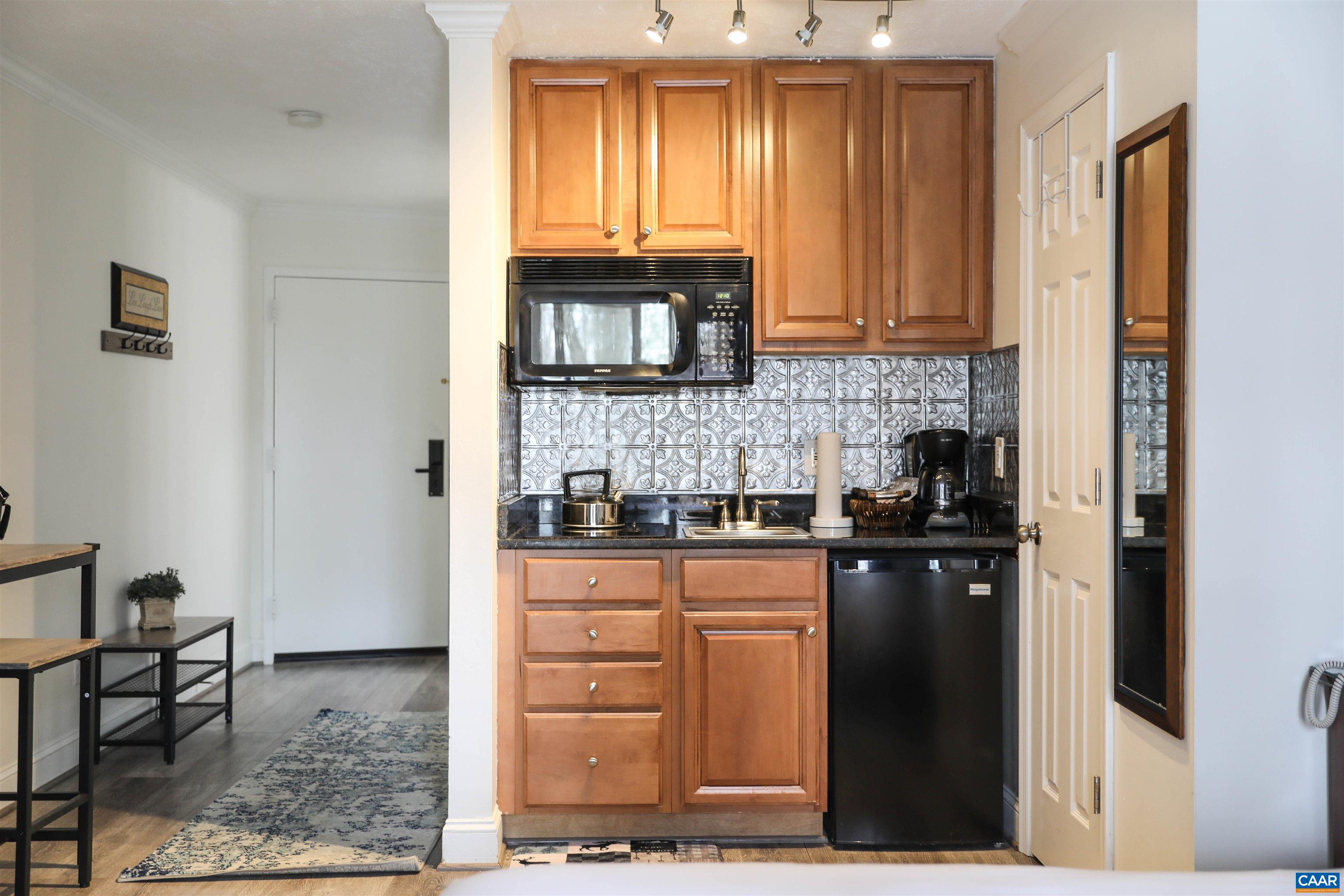 208 Timbers Roseland, VA 22967 - Photo 14 of 25 a kitchen with stainless steel appliances granite countertop a stove a sink and a refrigerator