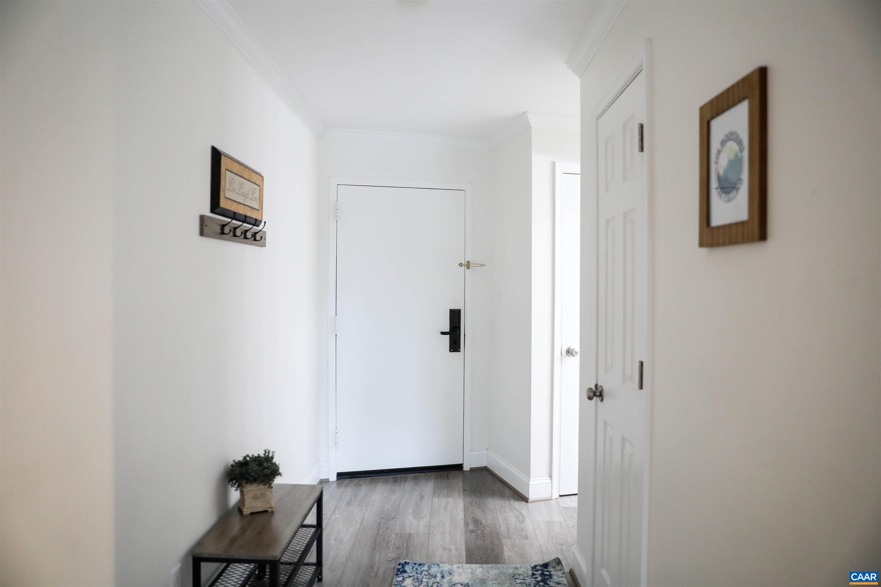 208 Timbers Roseland, VA 22967 - Photo 4 of 25 a view of a hallway with wooden floor and closet