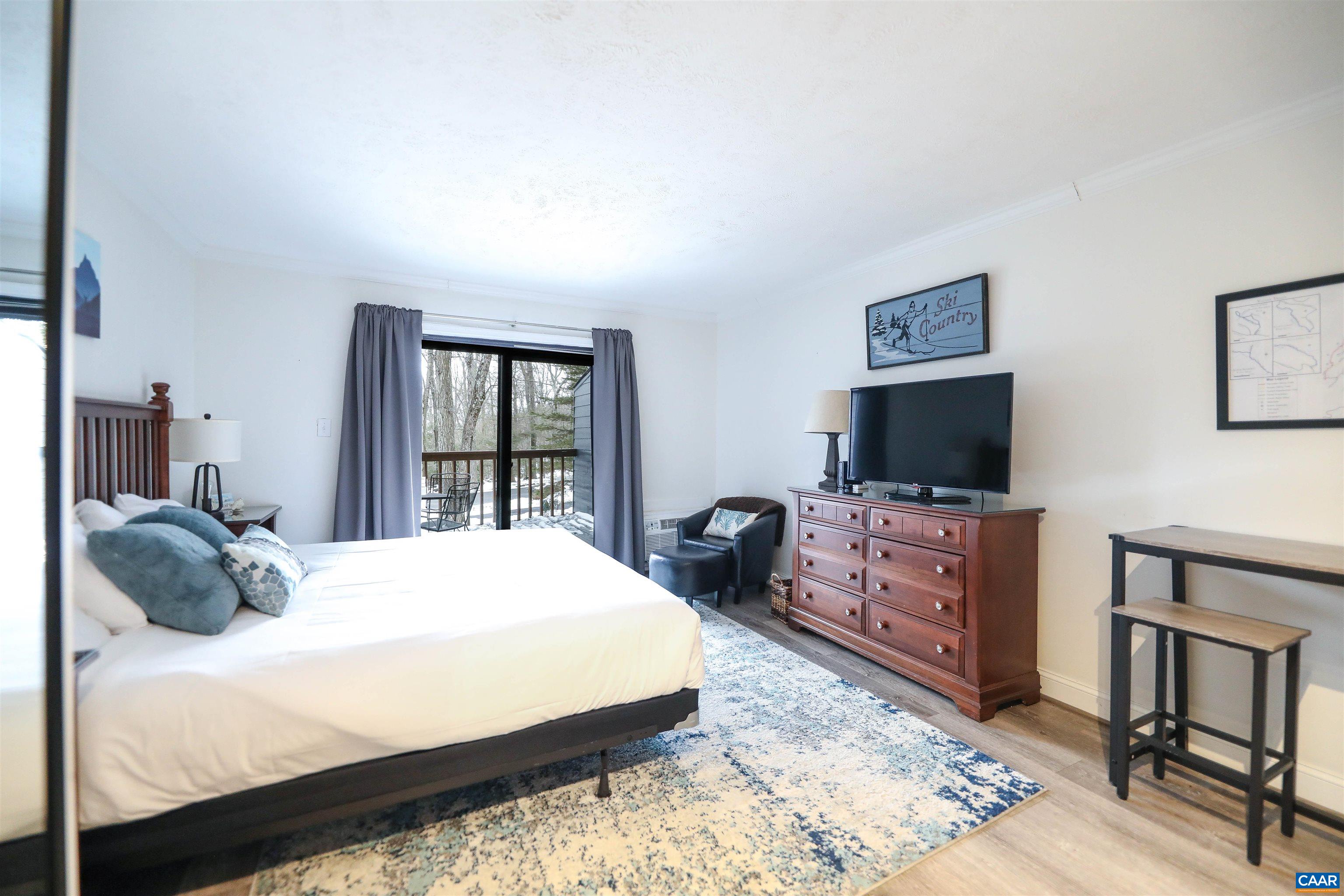 208 Timbers Roseland, VA 22967 - Photo 9 of 25 a bedroom with a bed and a flat screen tv