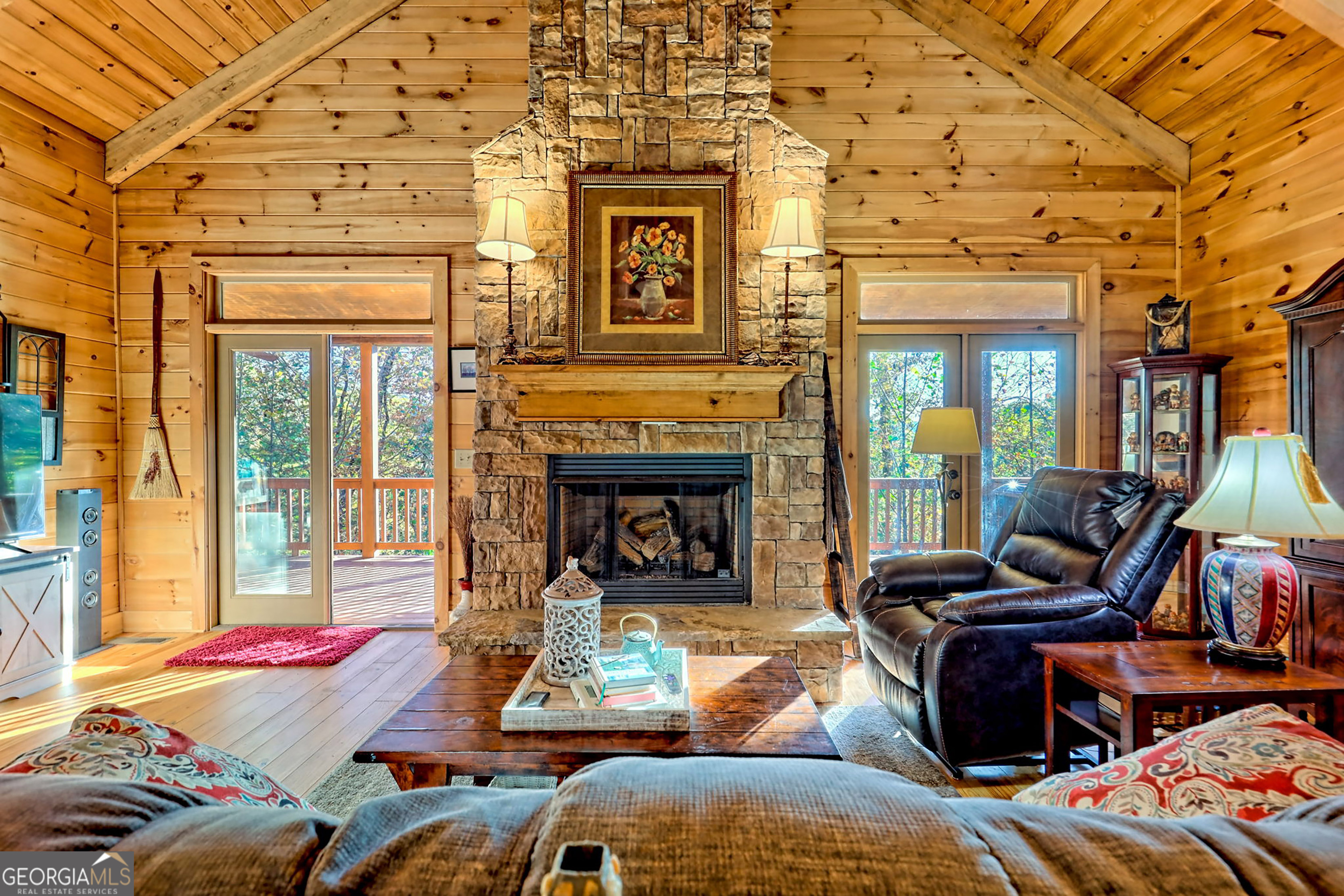 407 Blackberry Drive Rabun Gap, GA 30568 - Photo 11 of 53 a living room with furniture and a fireplace