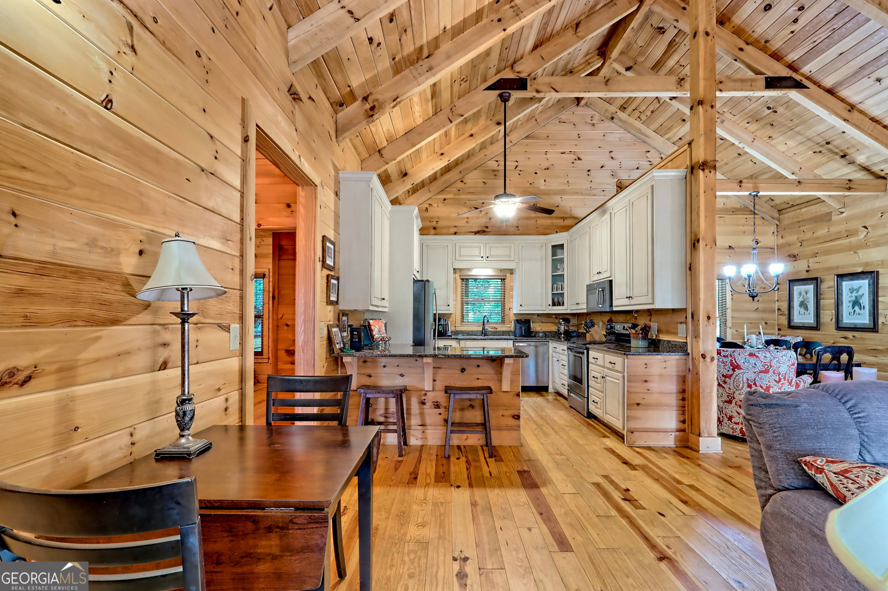 407 Blackberry Drive Rabun Gap, GA 30568 - Photo 14 of 53 a view of a living room with furniture and wooden floor