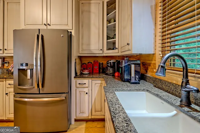 a kitchen with refrigerator and stove