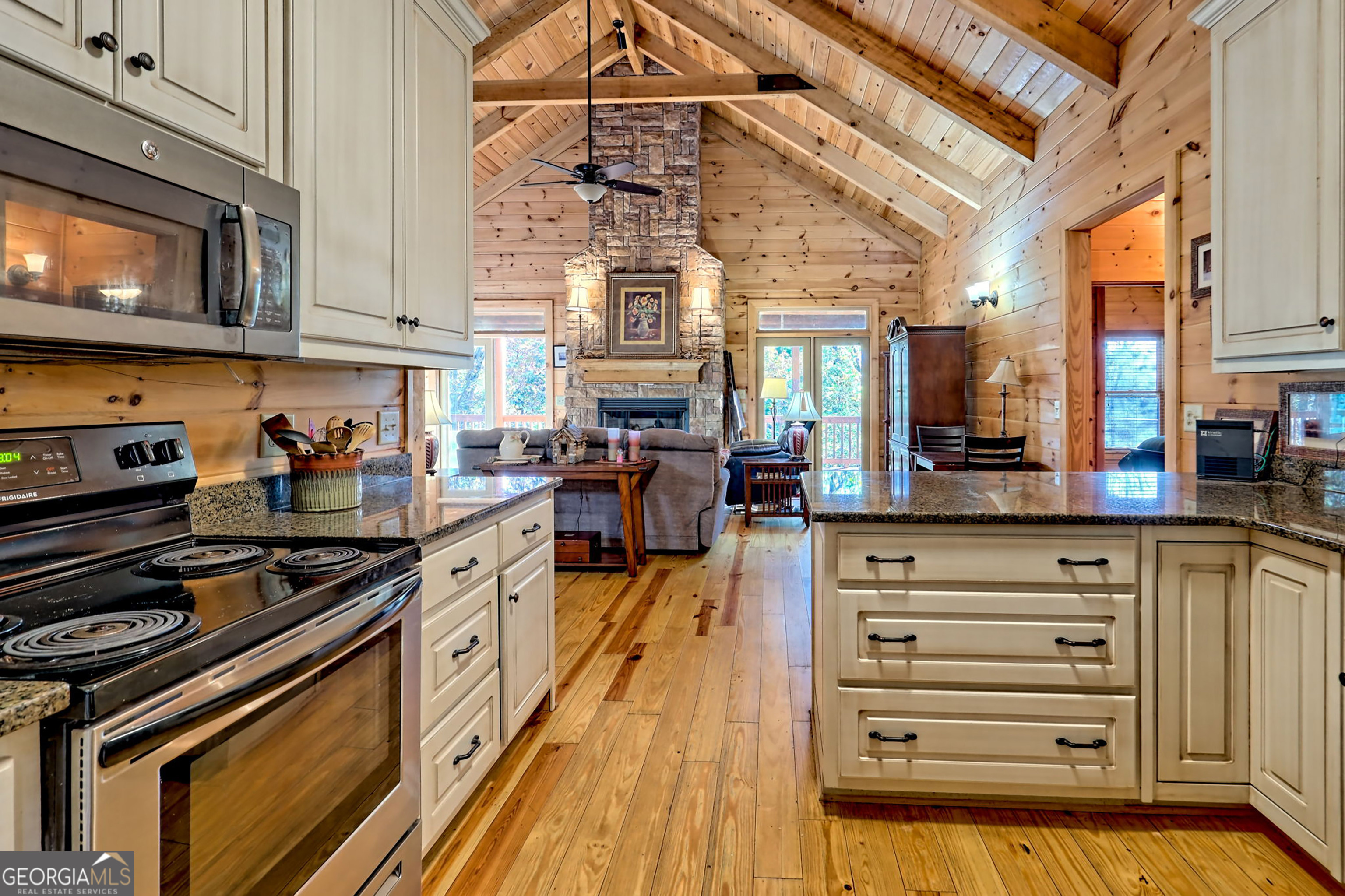 407 Blackberry Drive Rabun Gap, GA 30568 - Photo 20 of 53 a kitchen with stove and cabinets