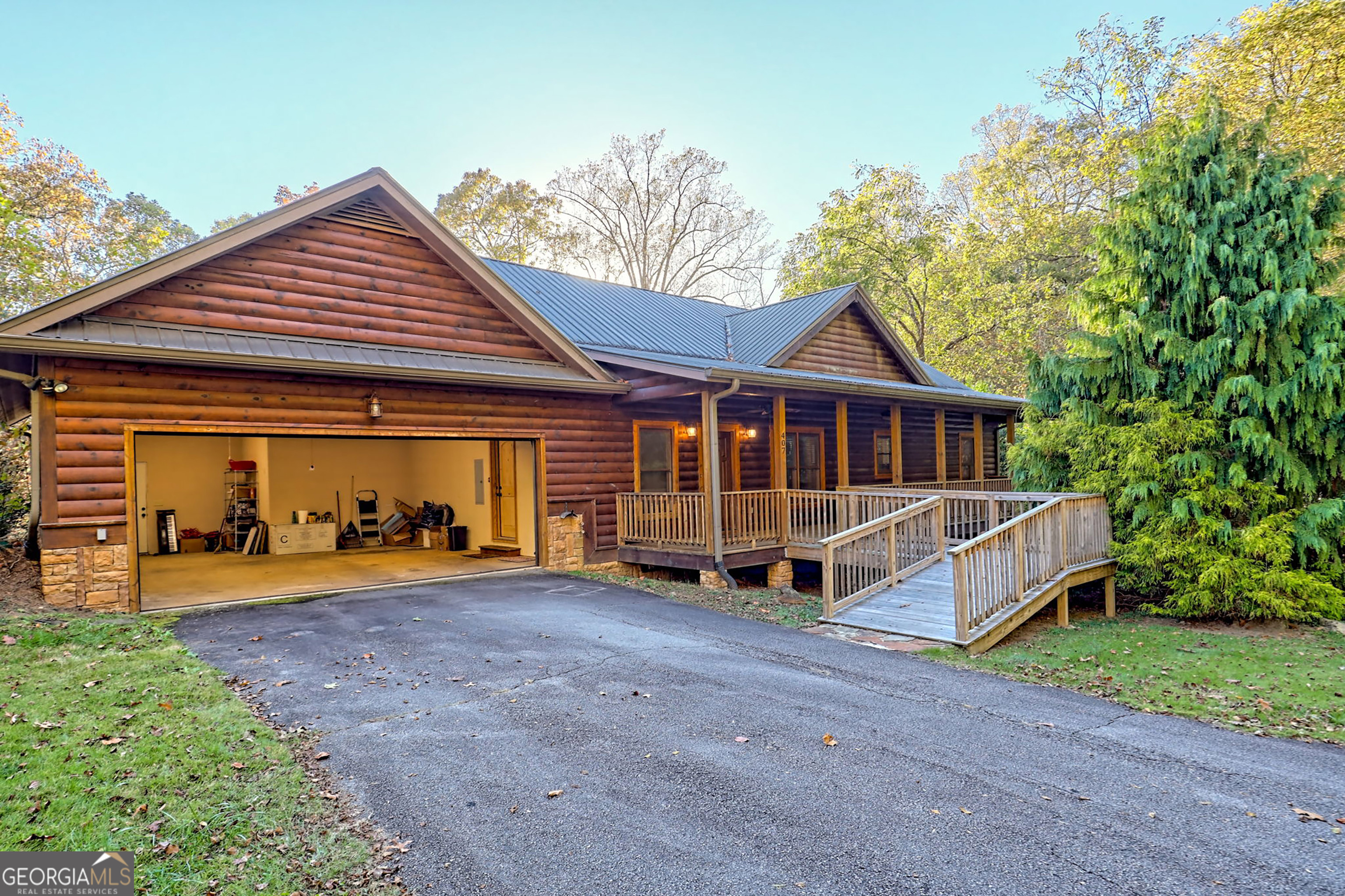 407 Blackberry Drive Rabun Gap, GA 30568 - Photo 2 of 53 a view of a house with a yard and sitting area