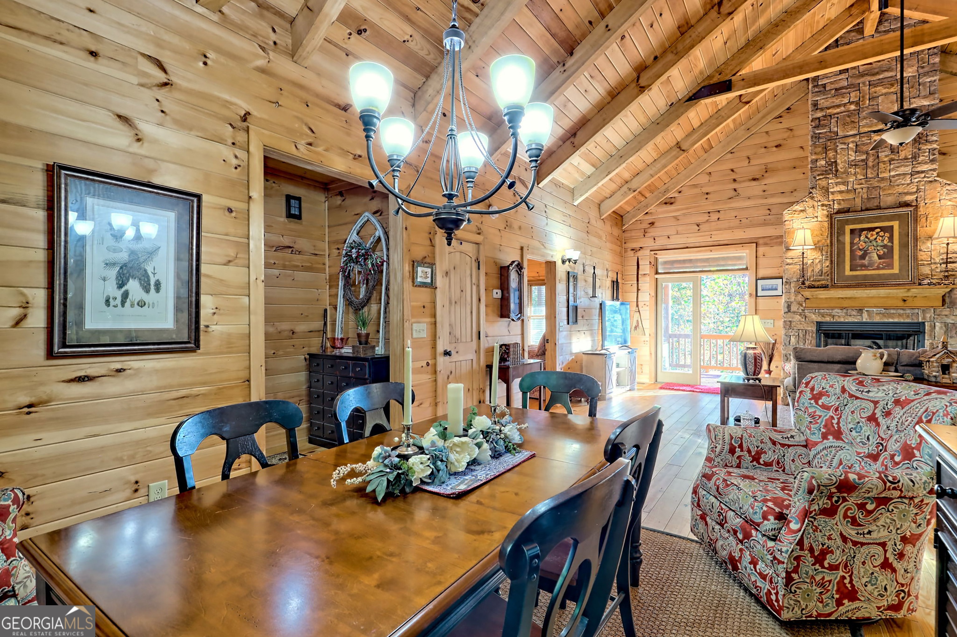 407 Blackberry Drive Rabun Gap, GA 30568 - Photo 23 of 53 a dining room with furniture and wooden floor