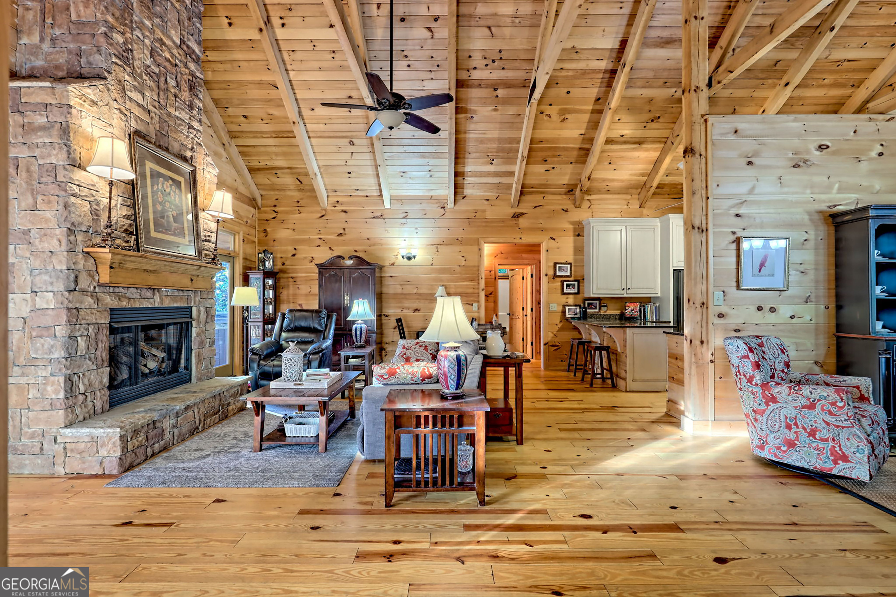 407 Blackberry Drive Rabun Gap, GA 30568 - Photo 27 of 53 a living room with lots of furniture and a fireplace