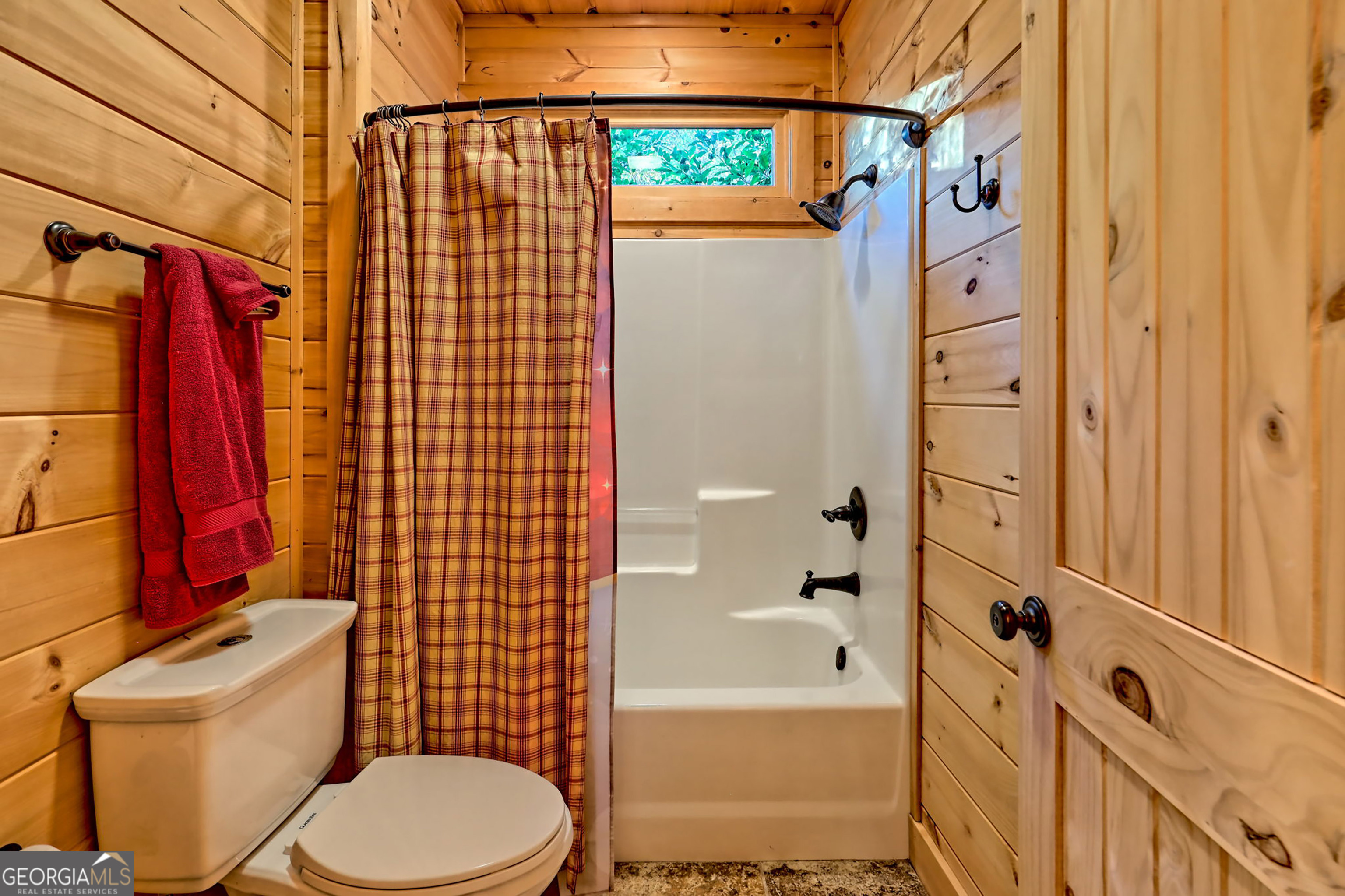 407 Blackberry Drive Rabun Gap, GA 30568 - Photo 31 of 53 a bathroom with a toilet and a shower