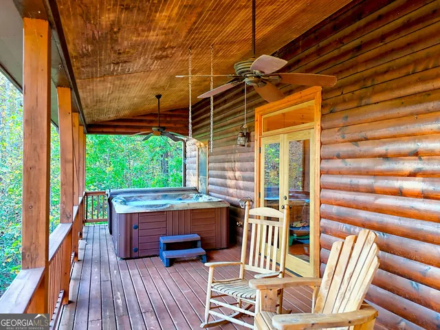 a balcony view with a seating space