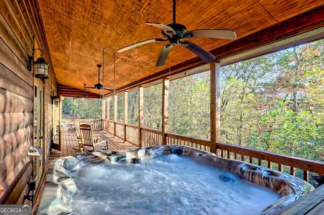 a living room with lots of wooden furniture and a table