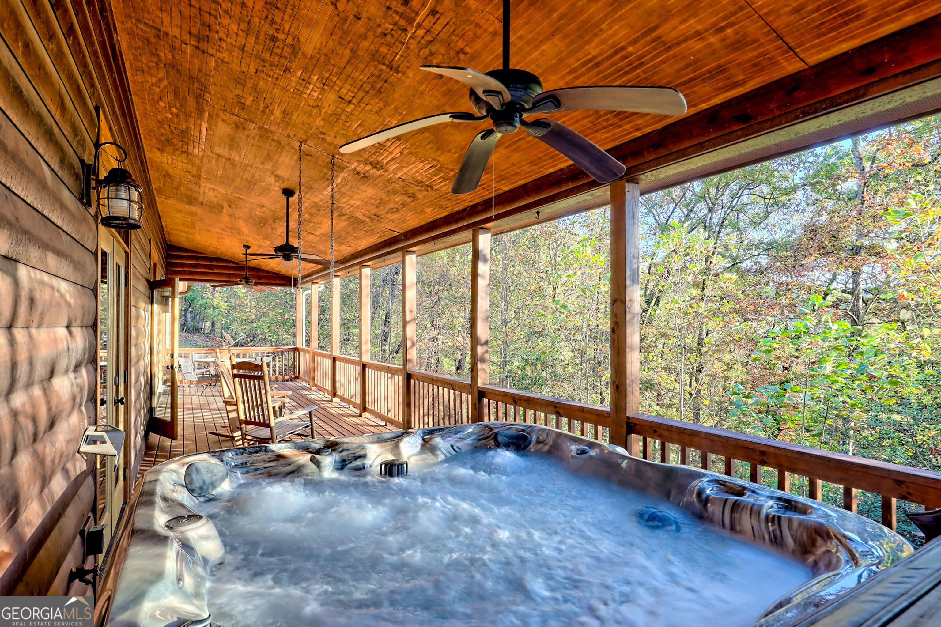 407 Blackberry Drive Rabun Gap, GA 30568 - Photo 38 of 53 a view of a porch with furniture and a yard