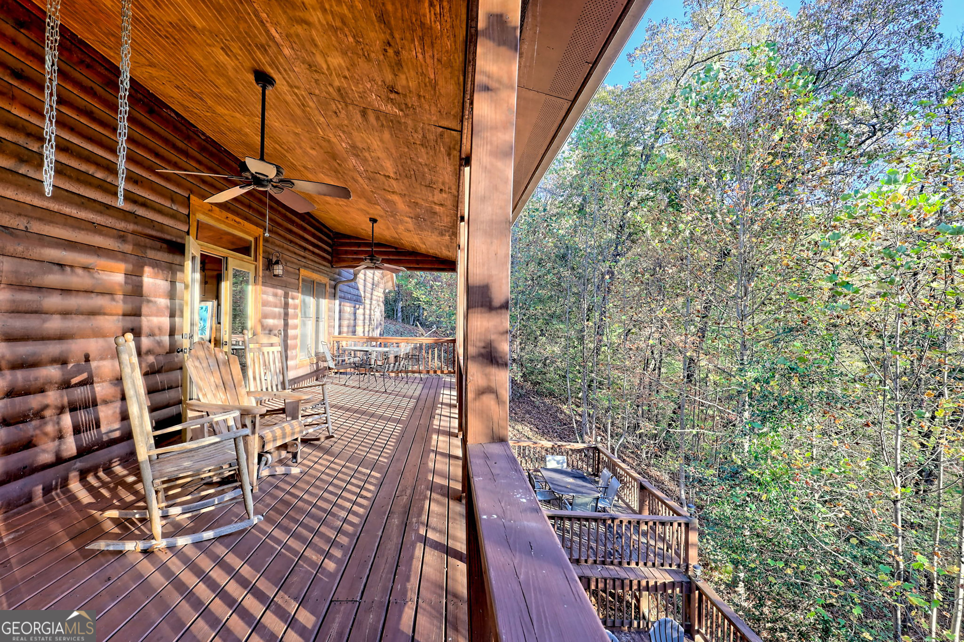 407 Blackberry Drive Rabun Gap, GA 30568 - Photo 39 of 53 a balcony with chairs and wooden floor