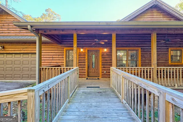 a view of a porch with wooden floor and fence