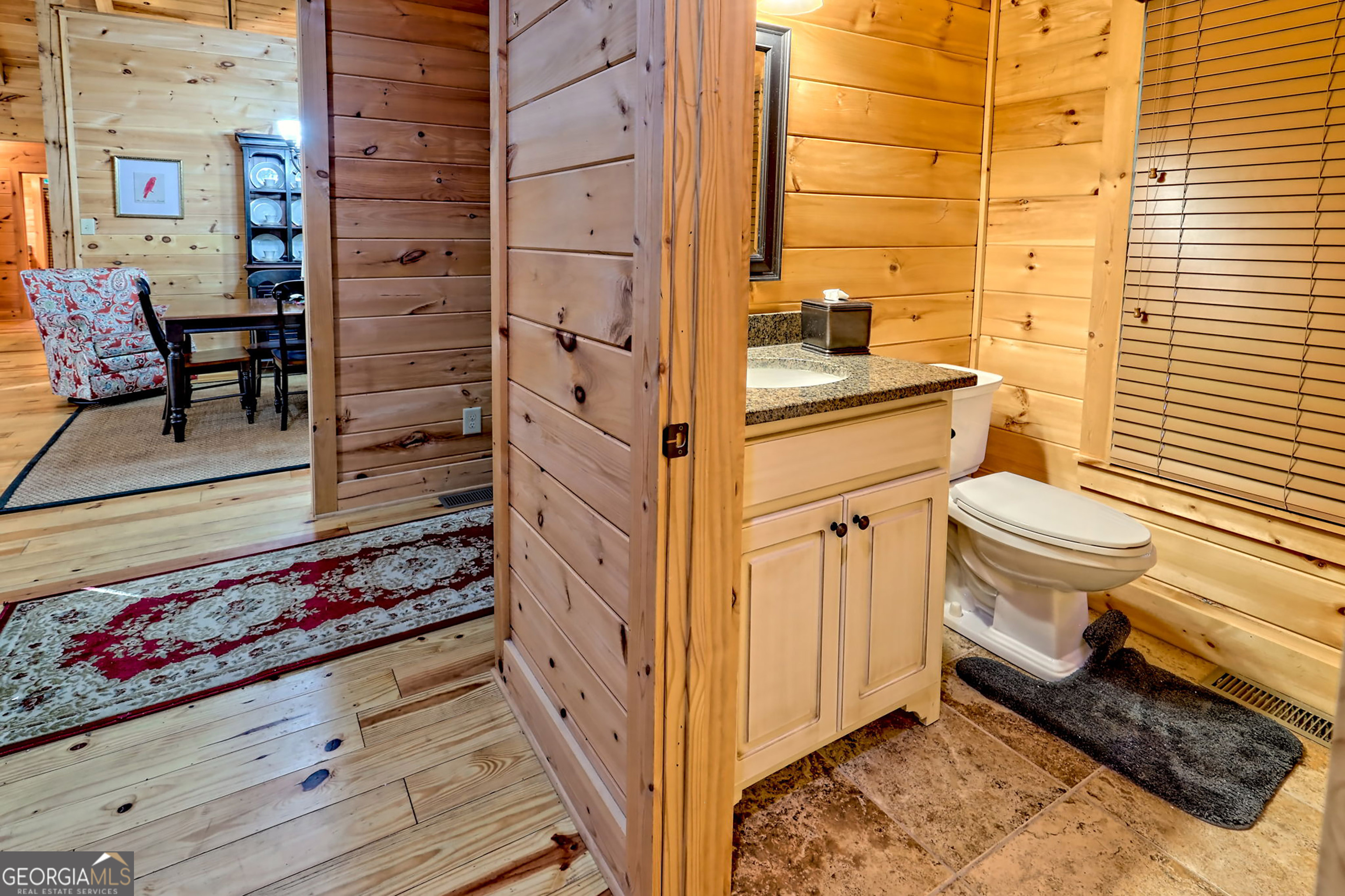 407 Blackberry Drive Rabun Gap, GA 30568 - Photo 42 of 53 a bathroom with a sink toilet and shower
