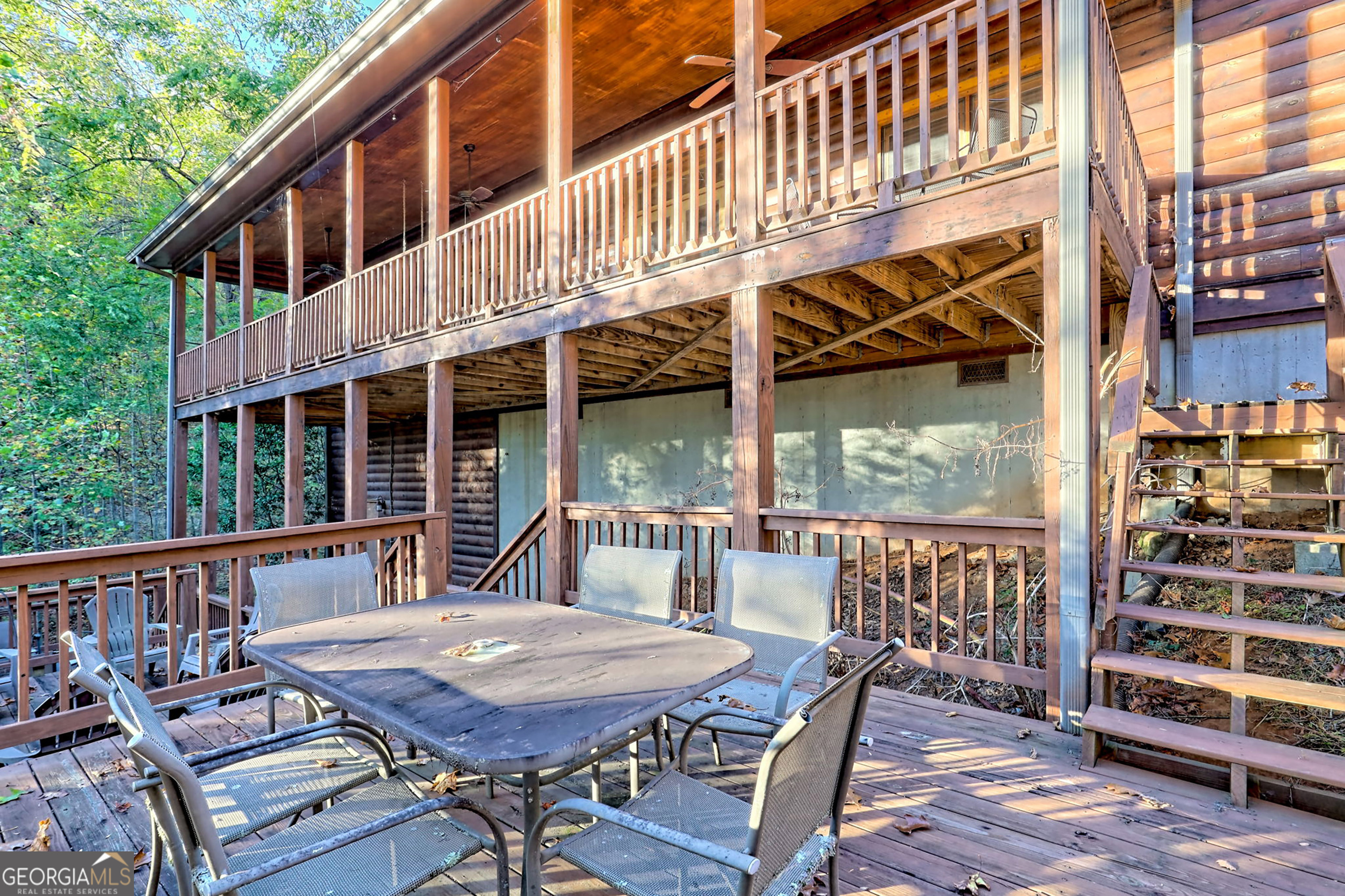 407 Blackberry Drive Rabun Gap, GA 30568 - Photo 47 of 53 a view of a balcony with table and chairs