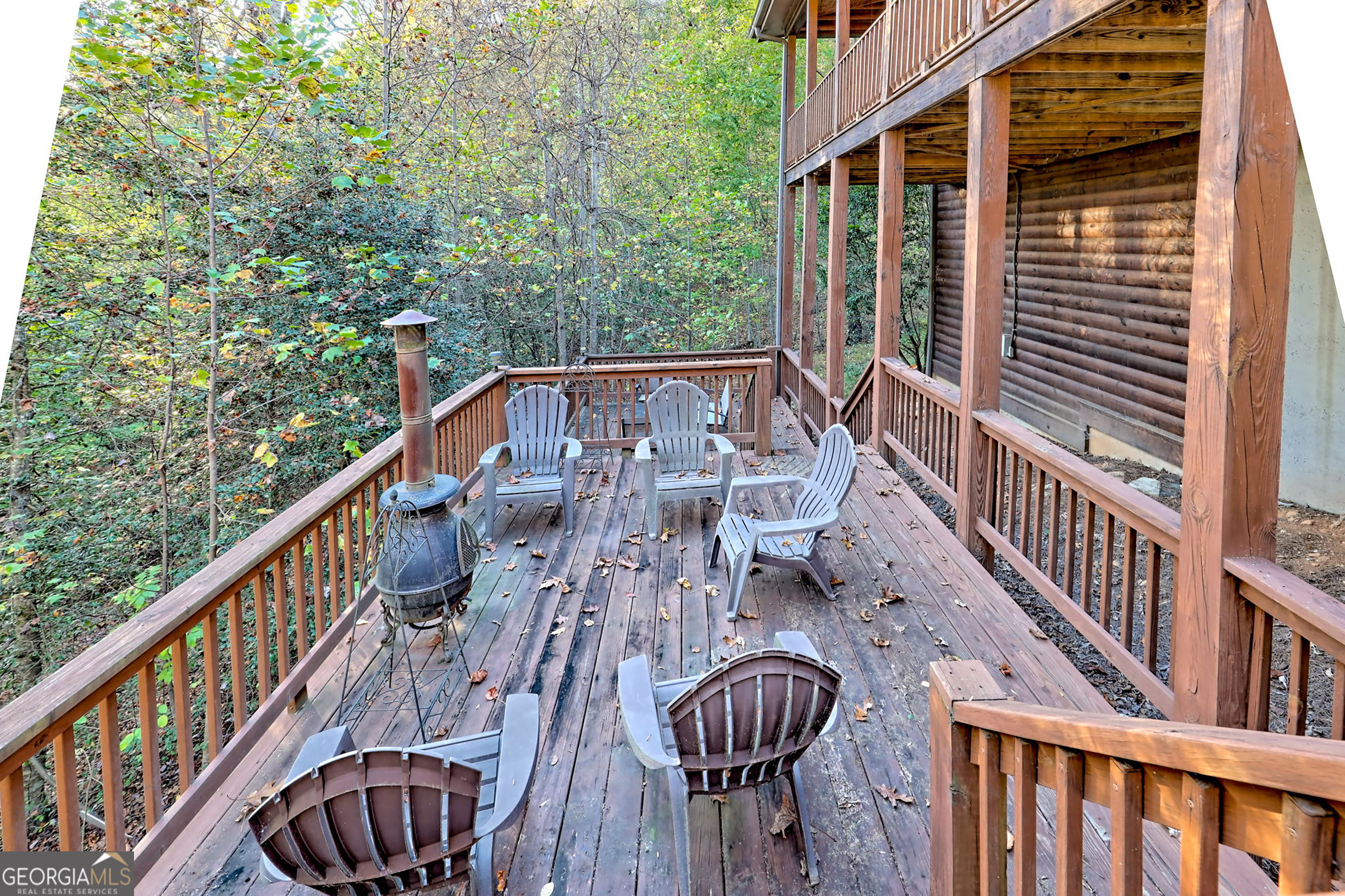 407 Blackberry Drive Rabun Gap, GA 30568 - Photo 48 of 53 a balcony with table and chairs
