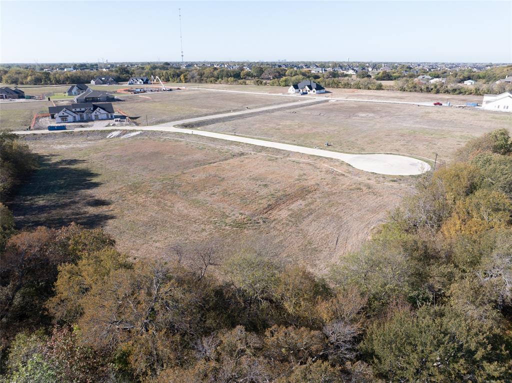 1001 Apollo Court Lucas, TX 75002 - Photo 2 of 6 a view of a lake with beach and city view