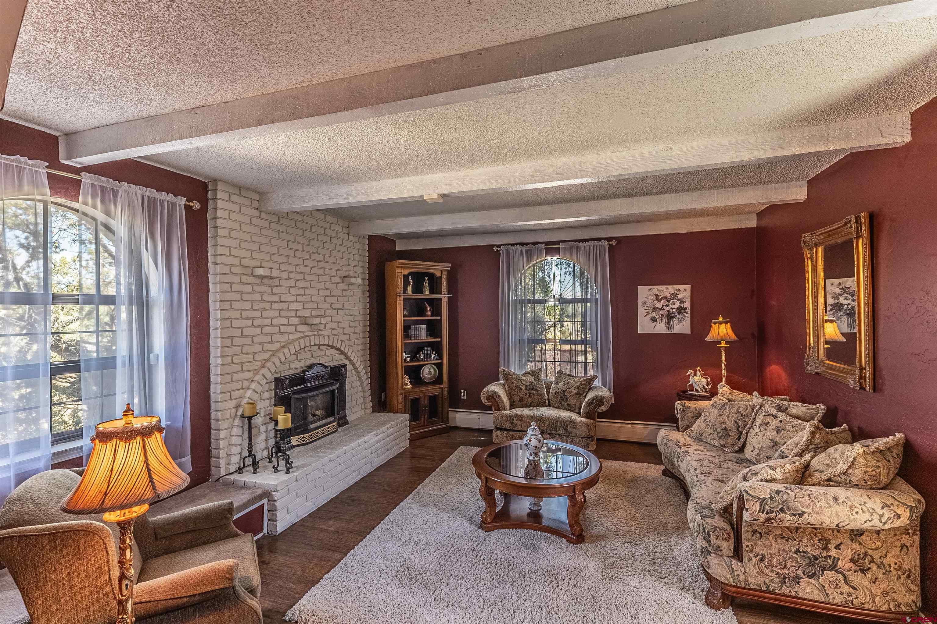 5510 Rinconada Street Farmington, NM 87402 - Photo 14 of 45 a living room with furniture and a potted plant