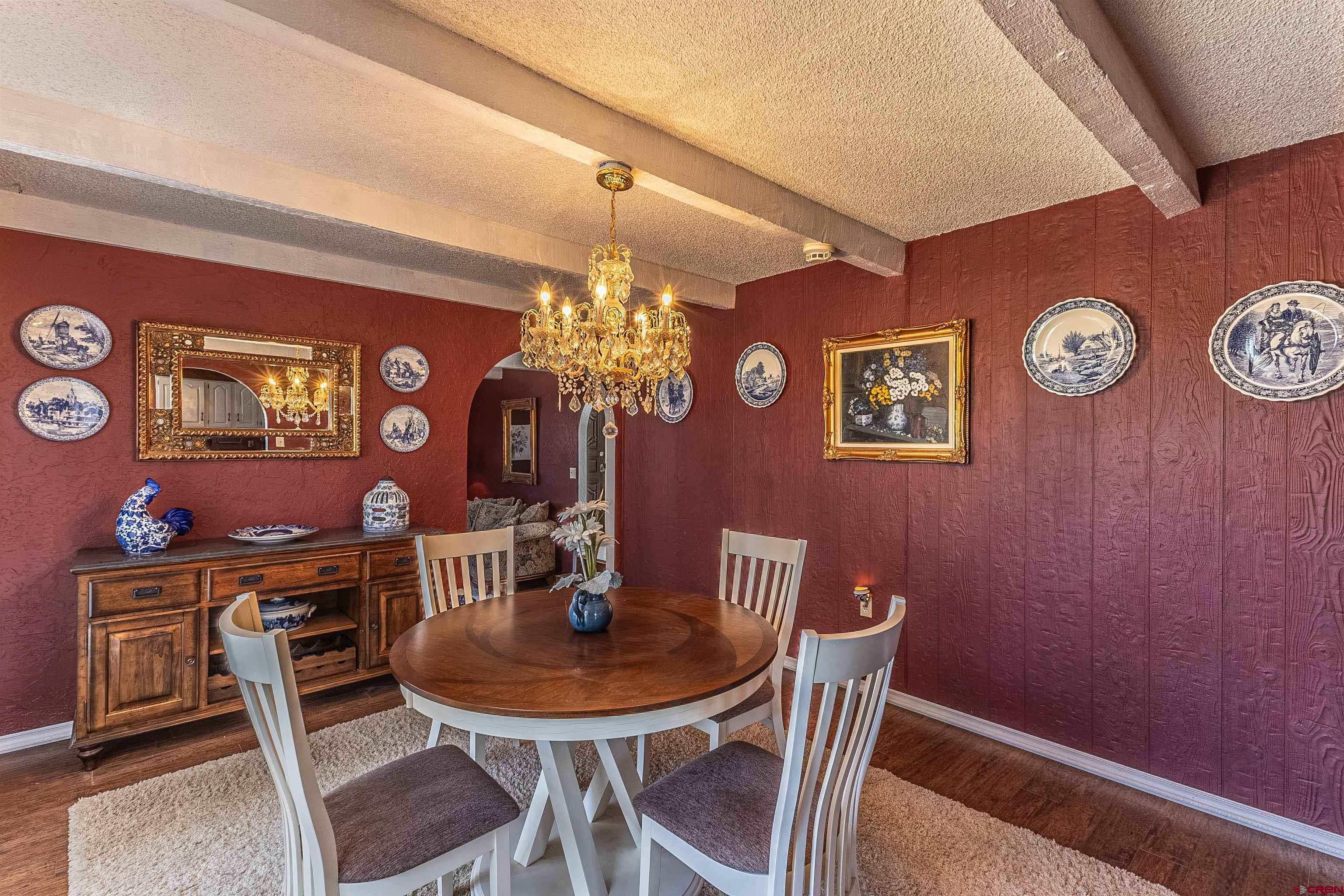5510 Rinconada Street Farmington, NM 87402 - Photo 17 of 45 a view of a dining room with furniture and chandelier