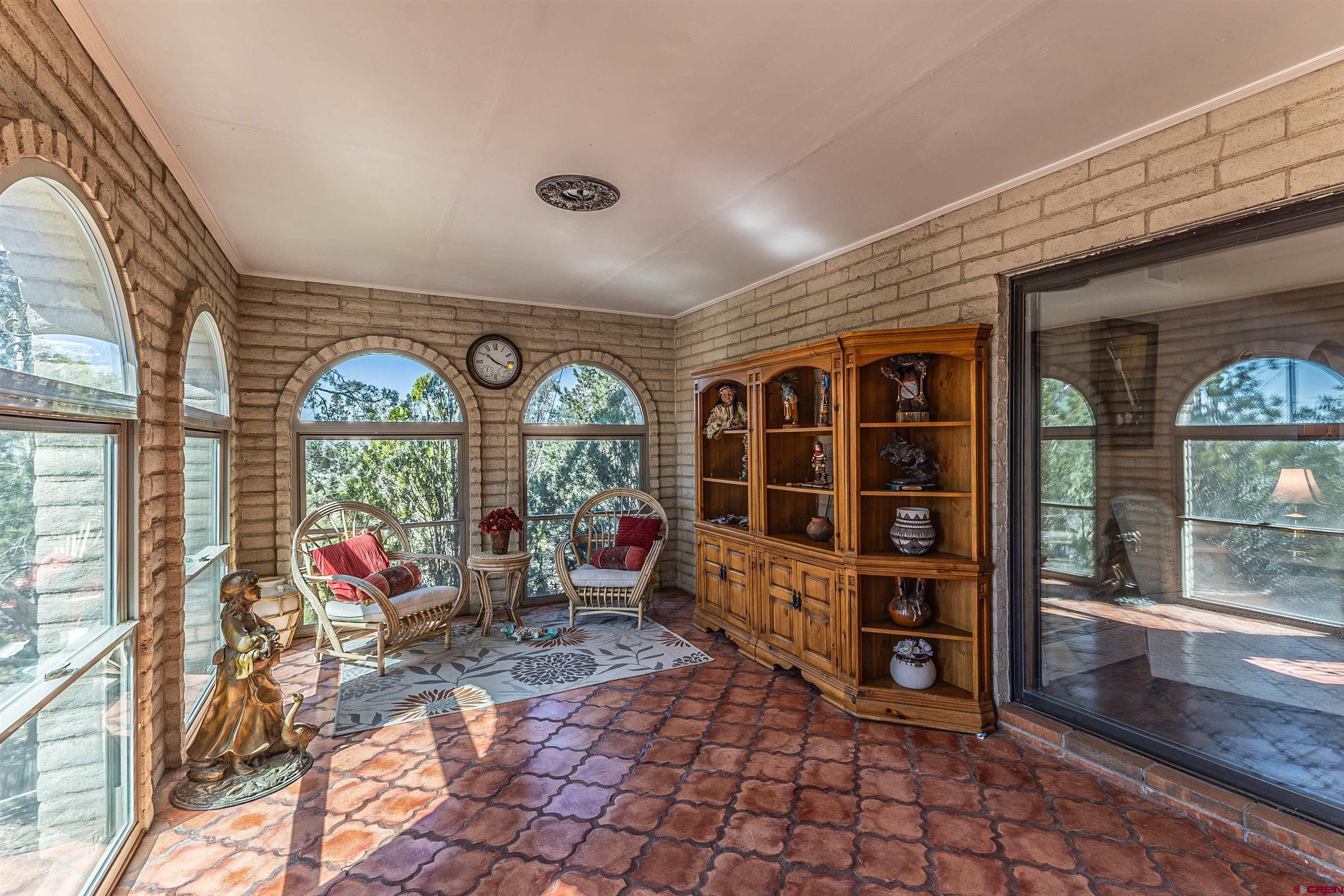5510 Rinconada Street Farmington, NM 87402 - Photo 2 of 45 a view of living room filled with furniture and floor to ceiling window